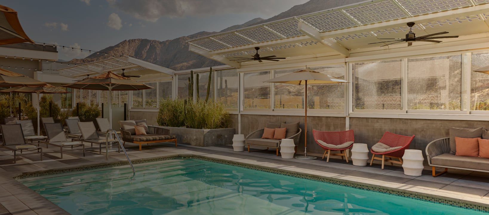 Poolside at the Kimpton Rowan Palm Springs with the mountains in the background