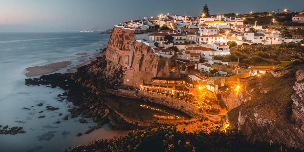 dramatic seaside cliffs with town of cascais overlooking the ocean 
