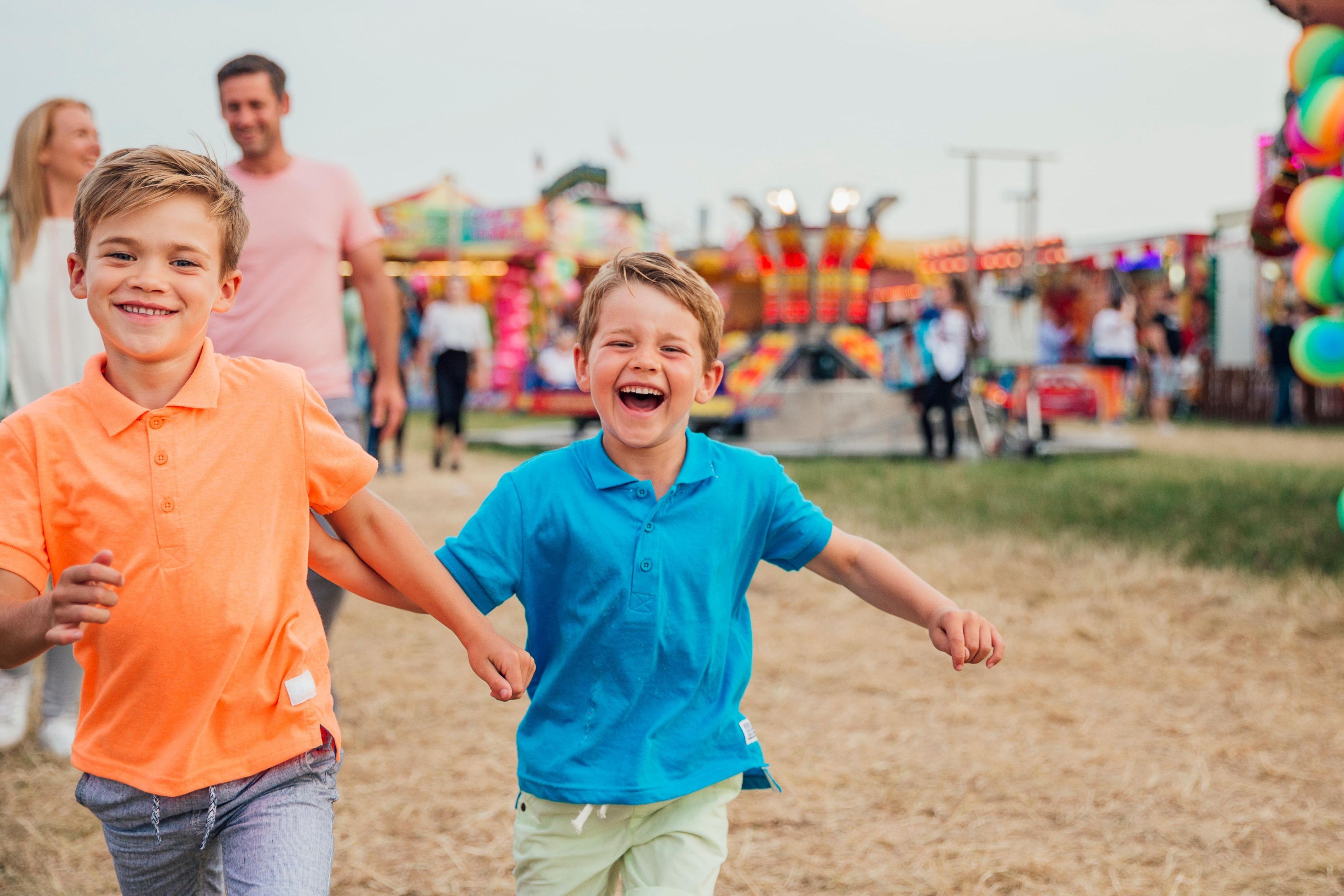 Kids running around at fair.