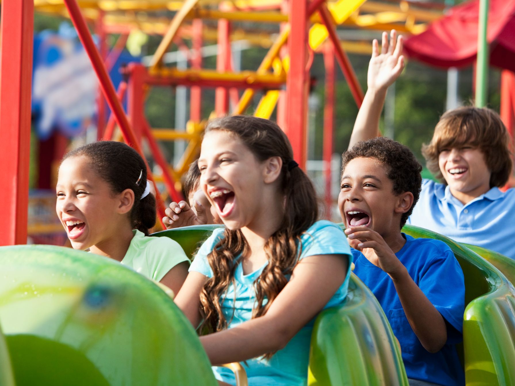 Kids having a blast on a roller coaster