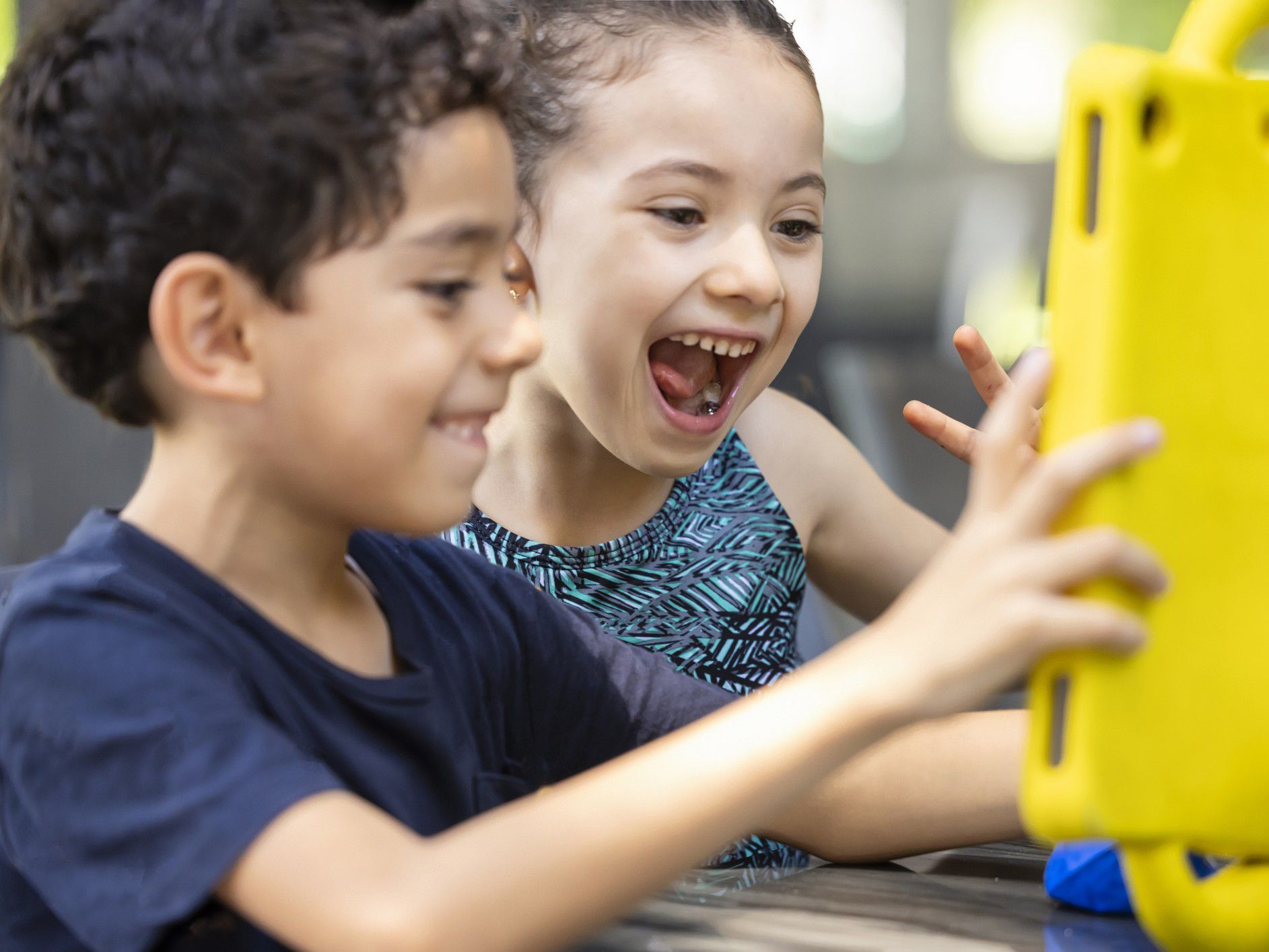 Kids playing on a tablet