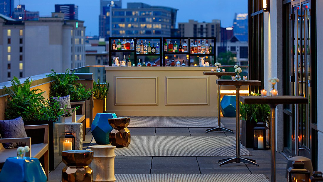 downtown hotel balcony bar at dusk