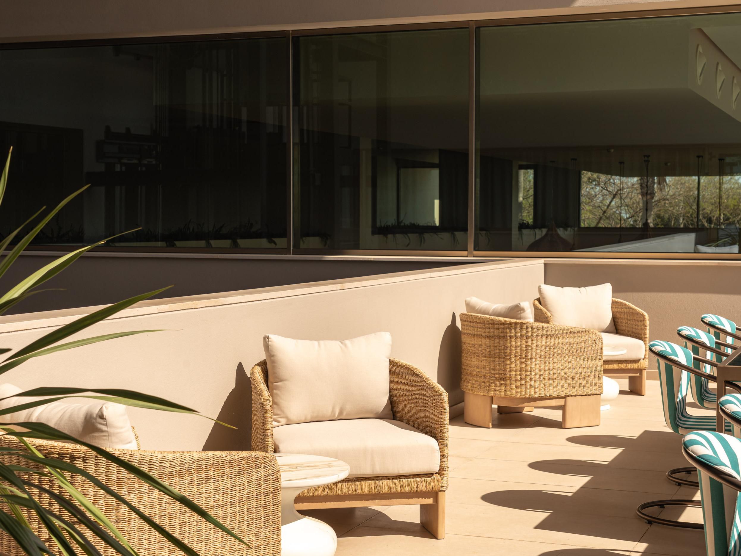 Chic outdoor lounge bathed in natural light