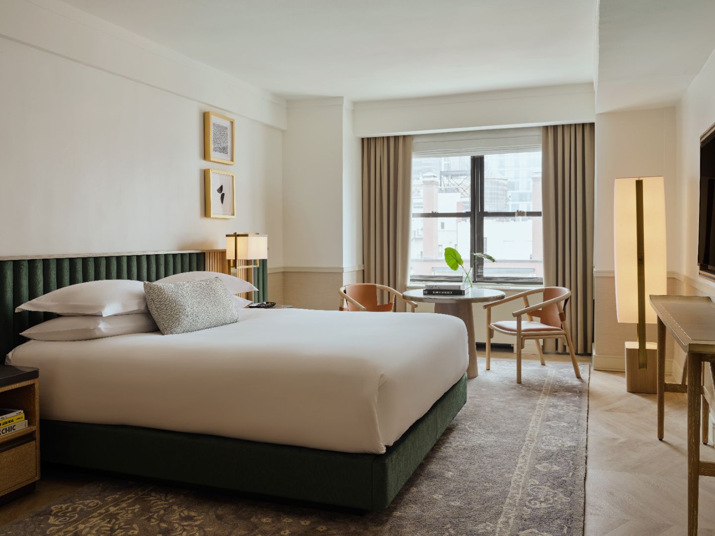 guestroom with luxe furnishings and new york views