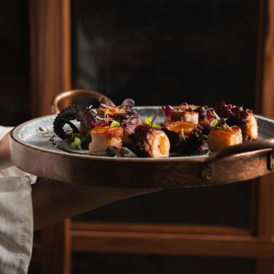 Confit octopus, cured pancetta and soy-orange sauce 