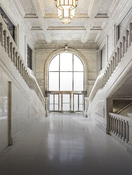 marble hallway with marble stairways on both sides