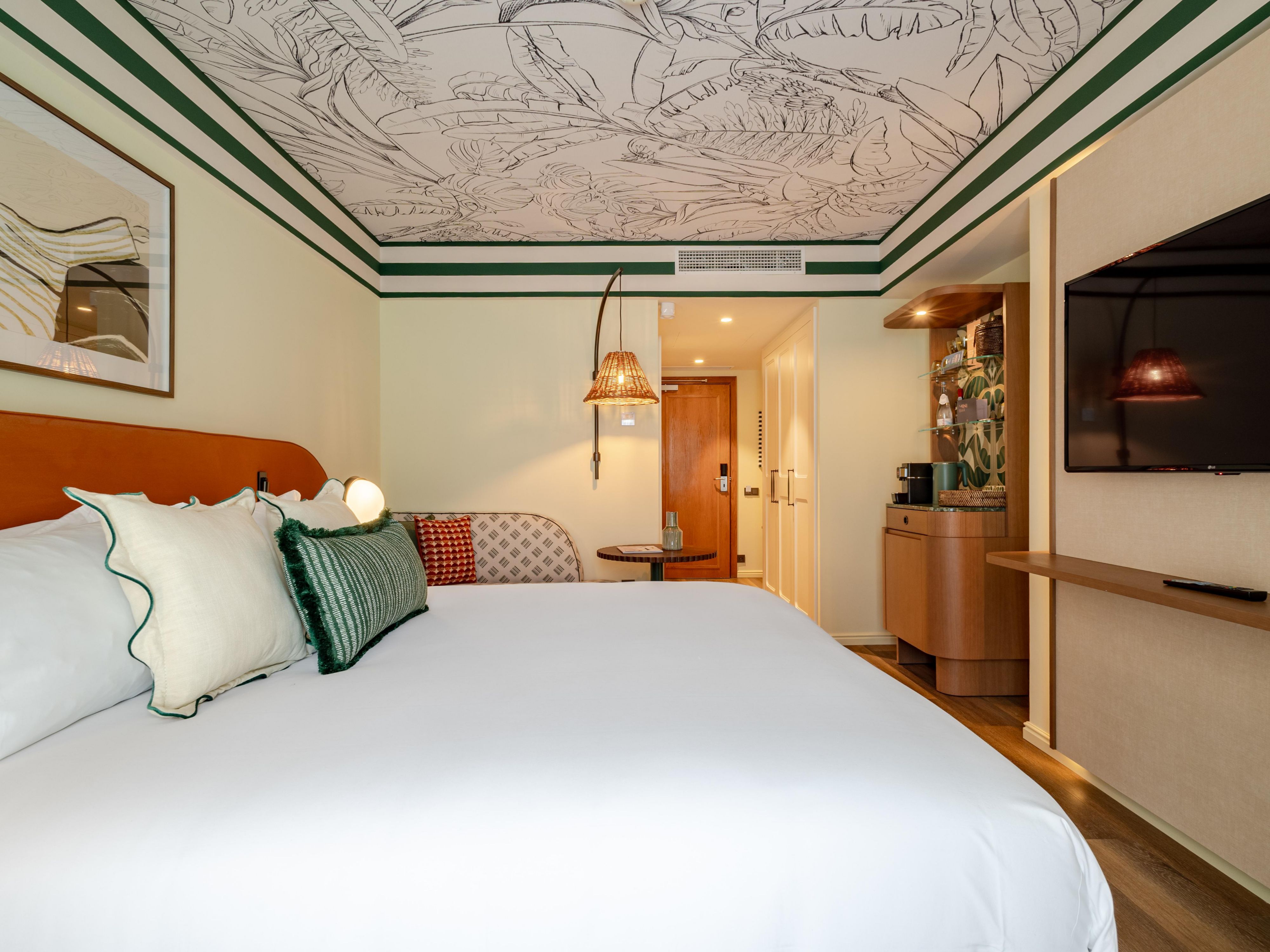 Elegant guest room with lounge space and warm inviting design
