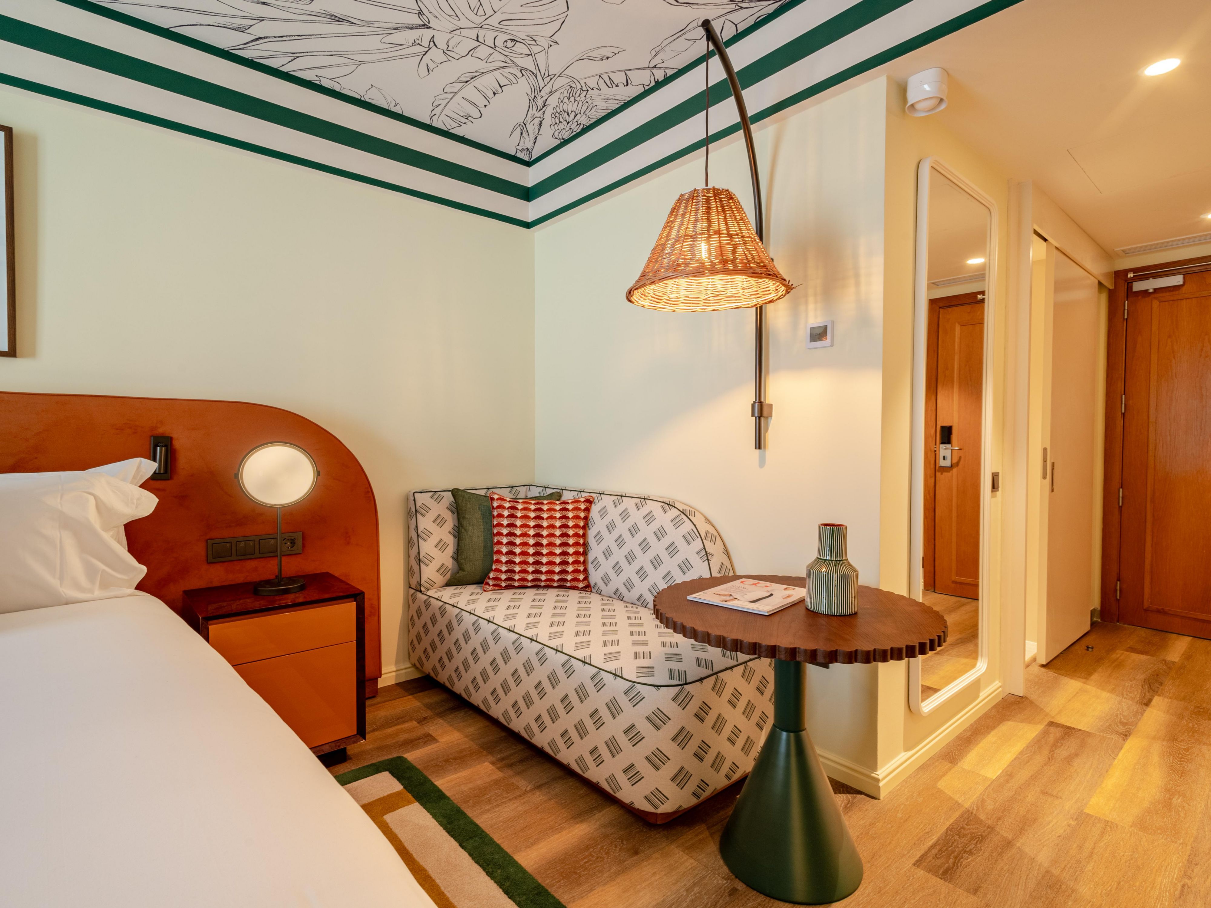 Stylish hotel room with cozy seating area and modern comfort