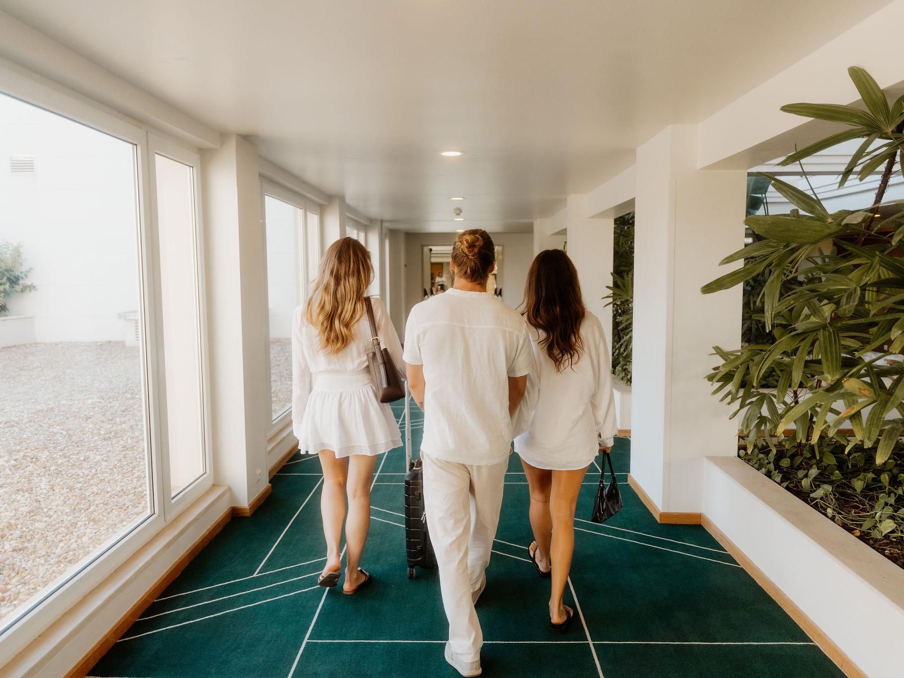 Spacious hotel corridors with elegant contemporary architecture.