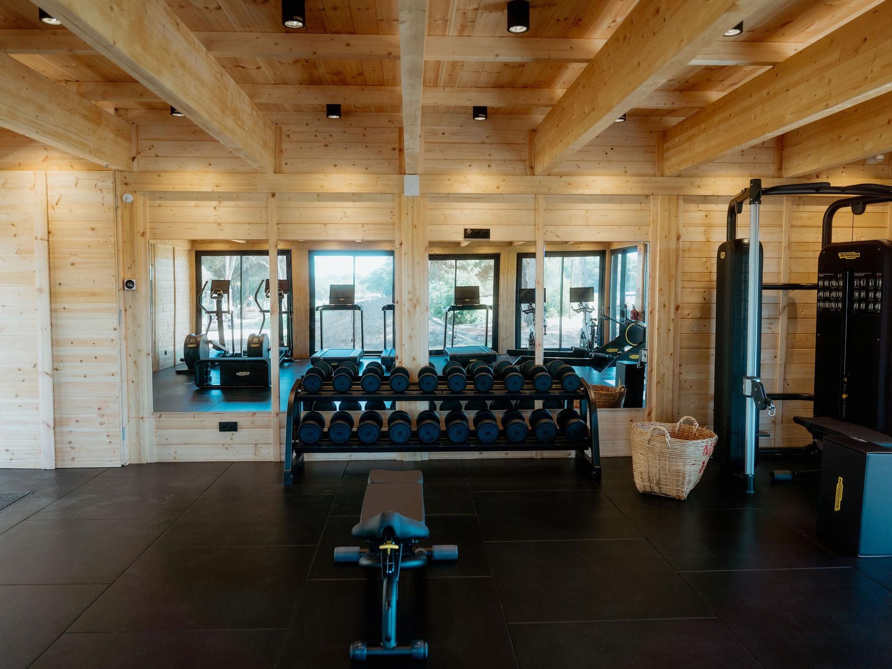 Spacious gym with modern equipment.