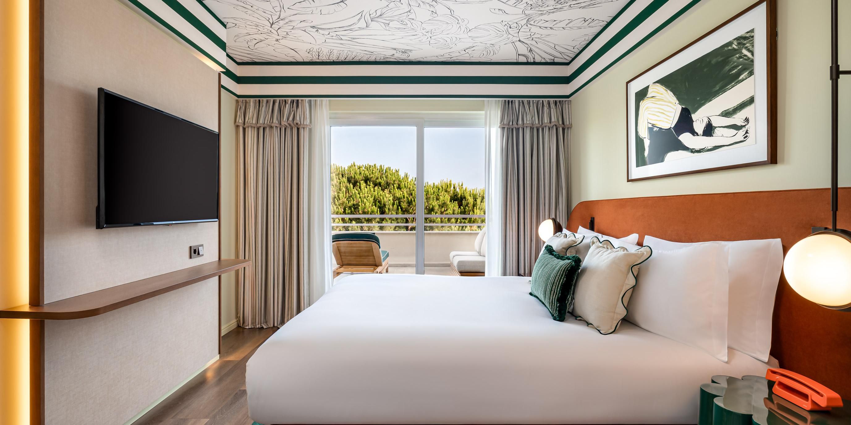 Contemporary room with terrace and golf course views.