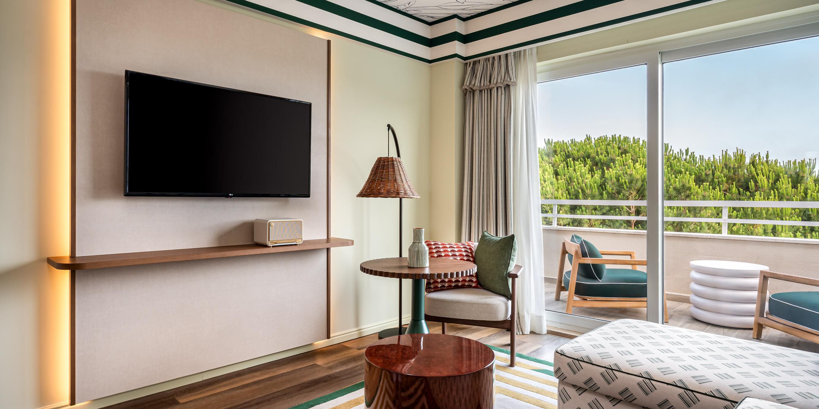 Elegant suite with lounge area and private balcony.