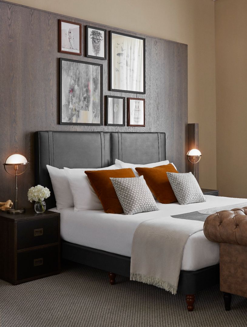 gray and rust colors adorn handsome large guestroom