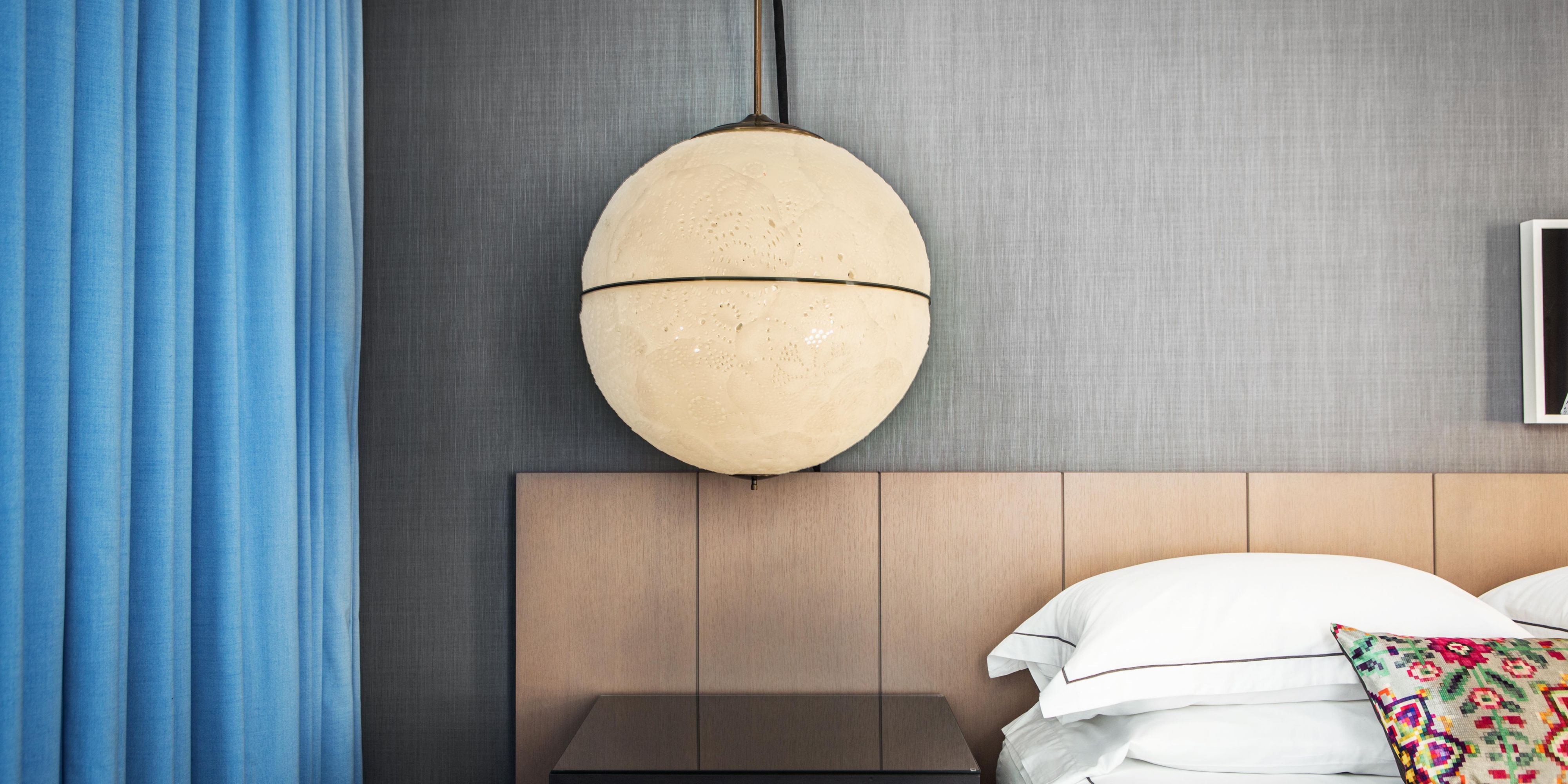 Sculptural pendant lighting elevates your Chicago stay.