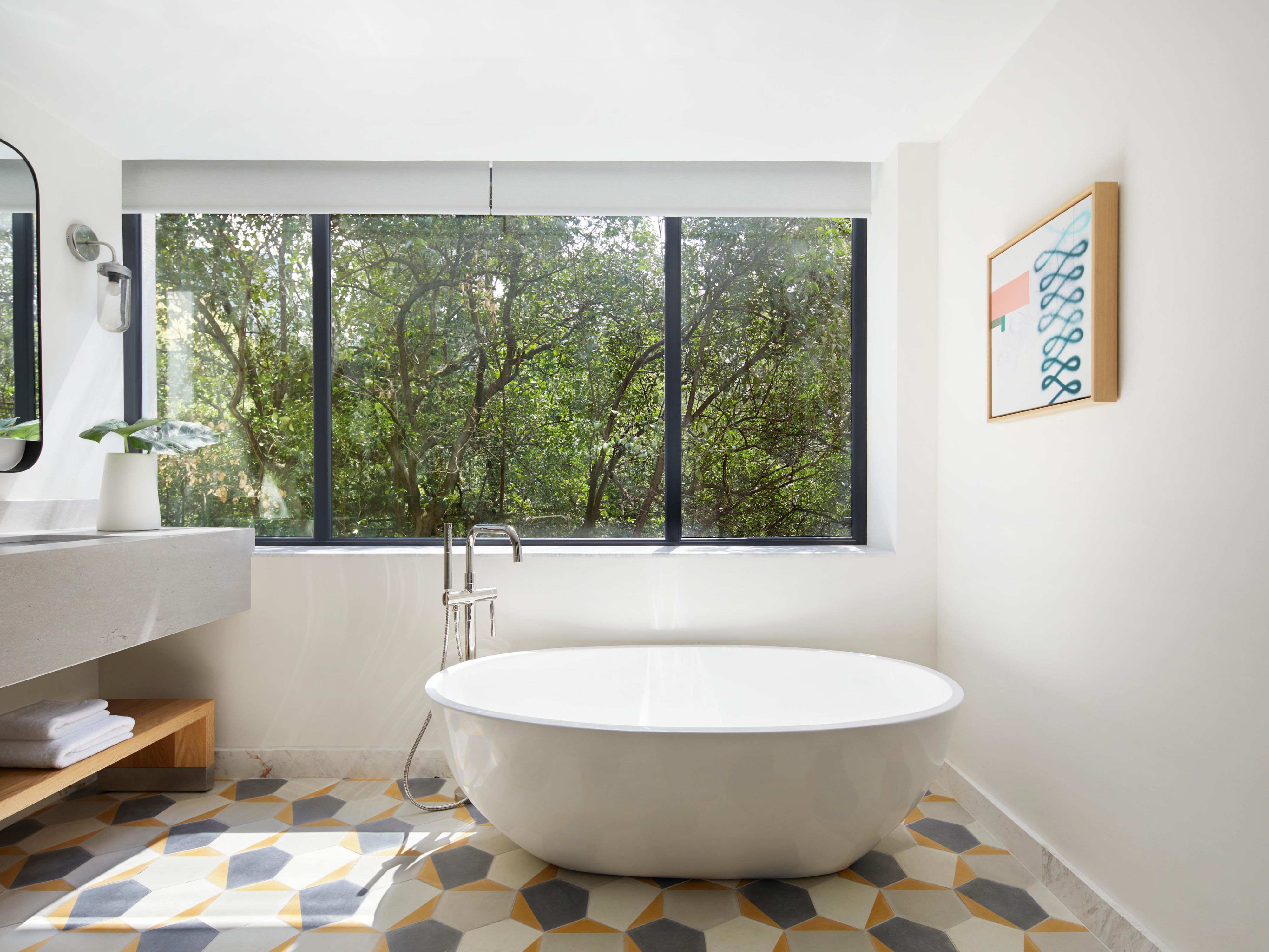 Freestanding soaking tub in Art Deco-designed bathroom
