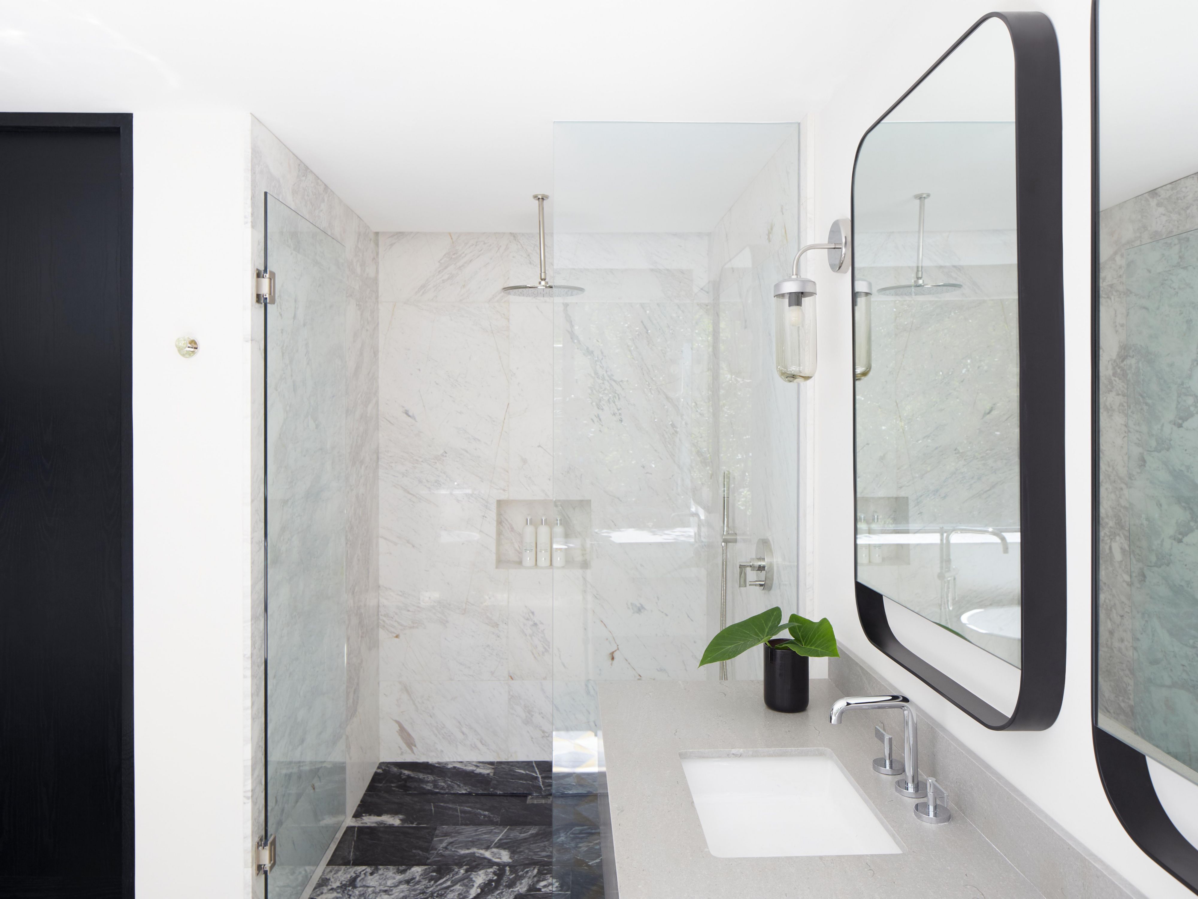 Walk-in shower and double vanity in luxury suite