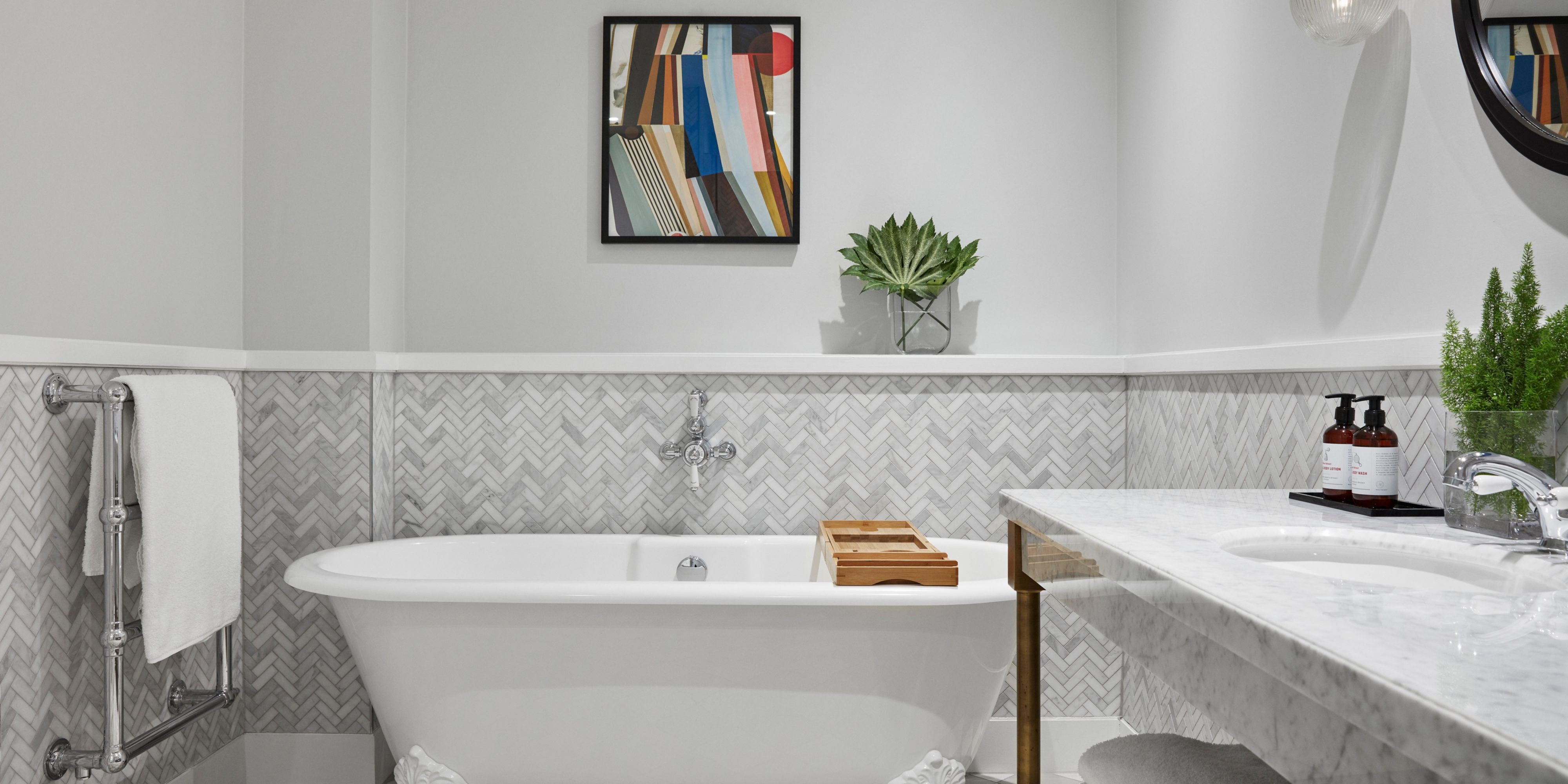 Ceramic & marble bathroom roll top bath & rainfall walk-in shower.