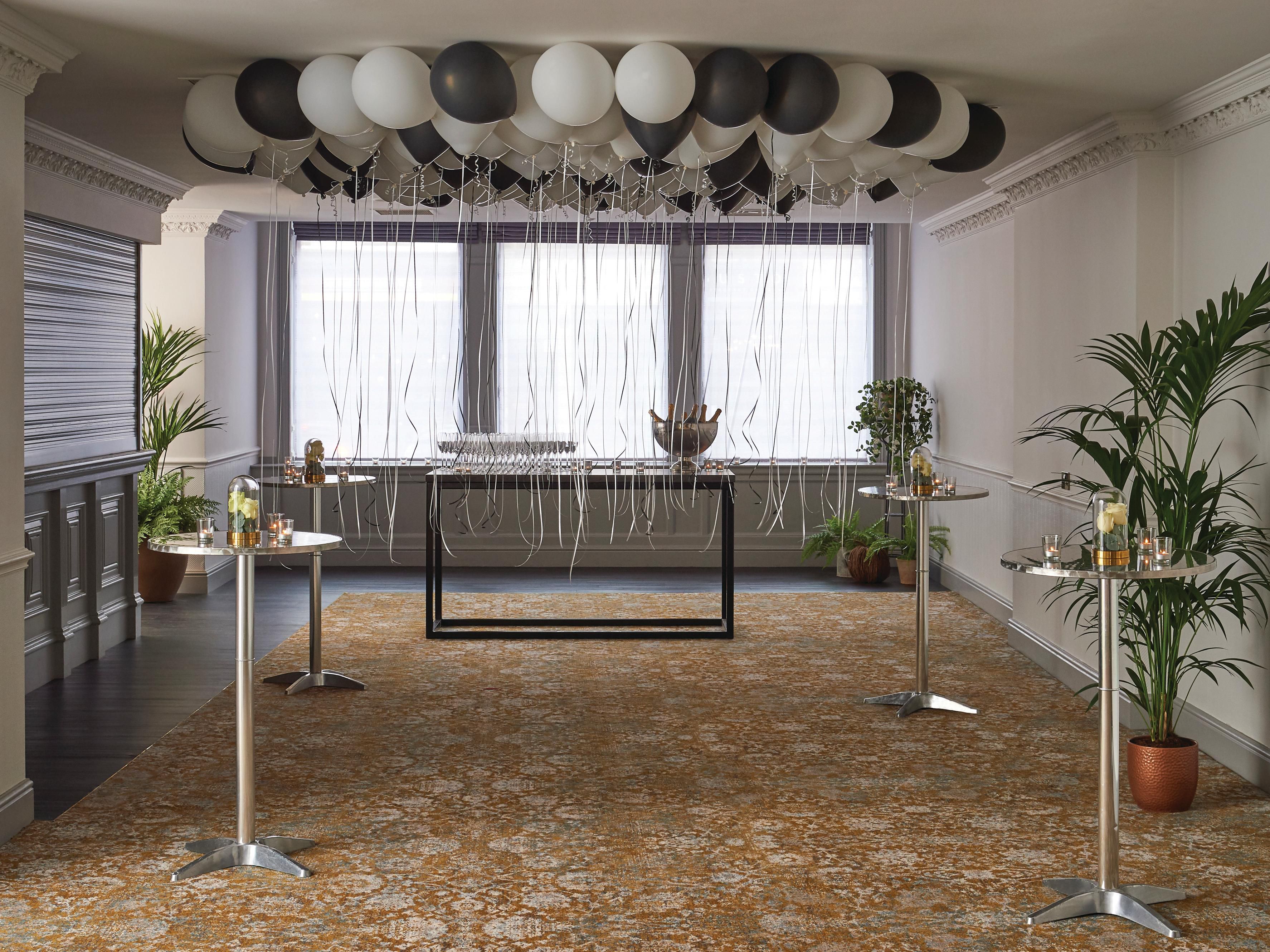 Room with hightop tables and balloons