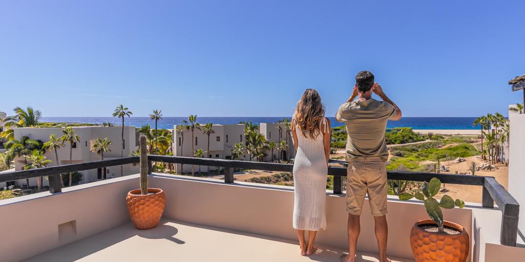 Soaking in sweeping ocean views from a sunlit private terrace.