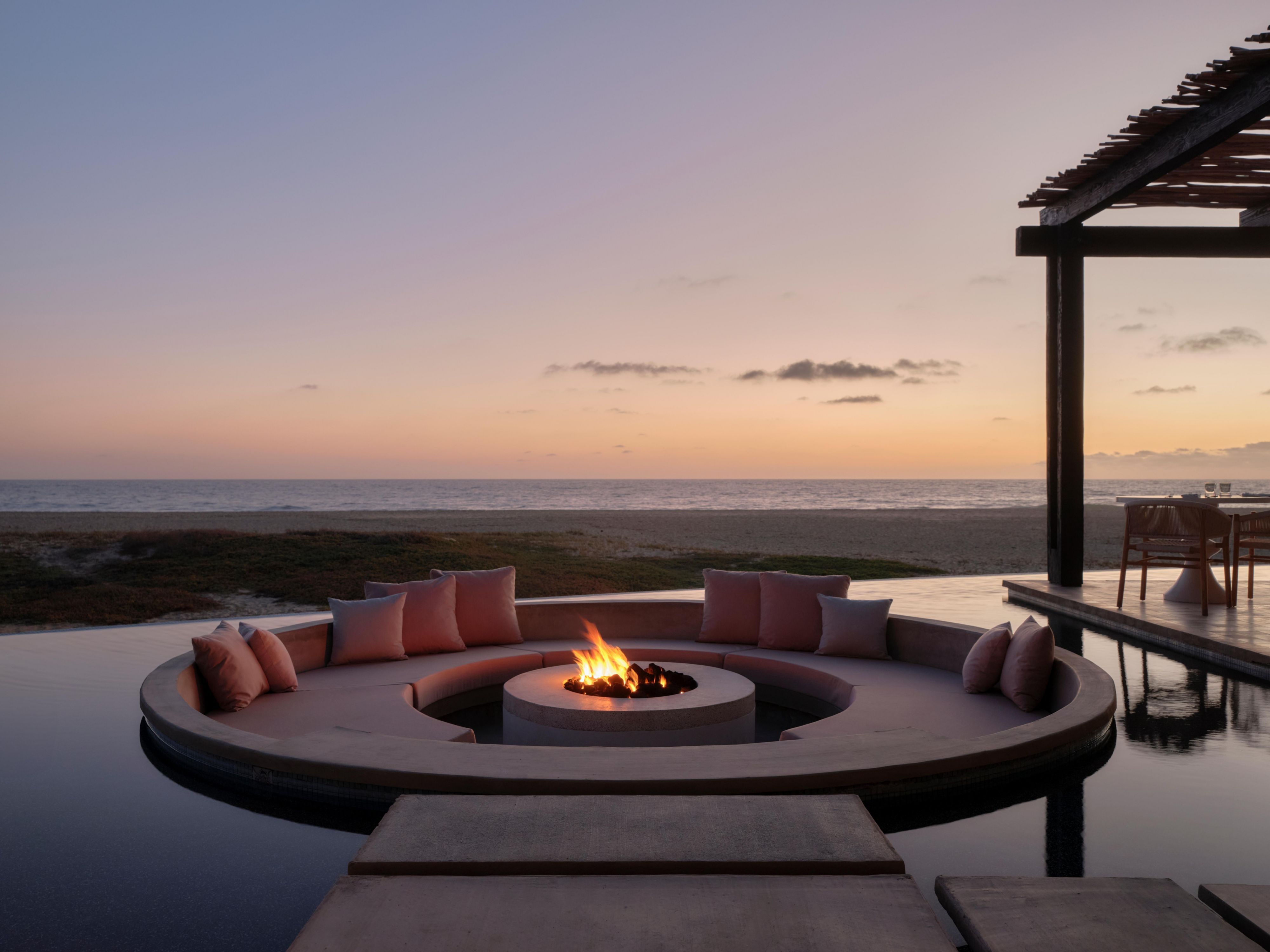 Firepit and swimming pool overlooking the Pacific Ocean.