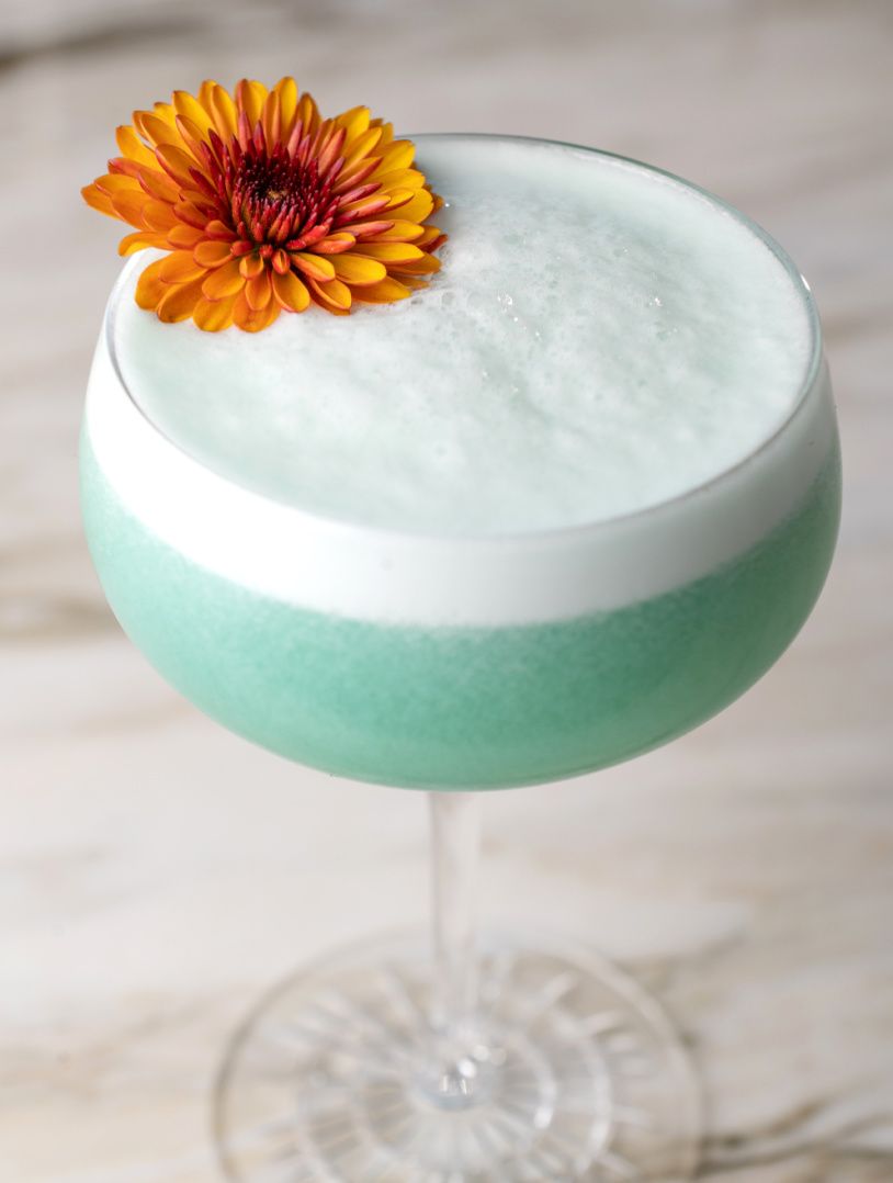 a honey bear cocktail in a glass of ice