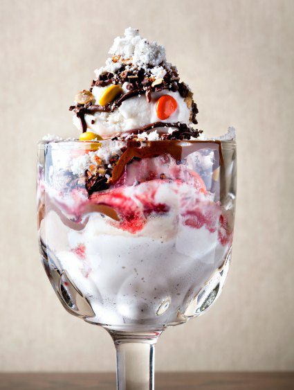 ice cream sundae with vanilla and chocolate sauce, whipped cream