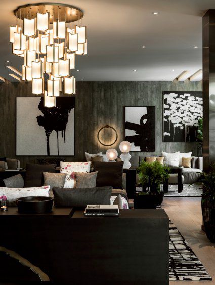 Upscale hotel room with a gray theme and fancy chandelier