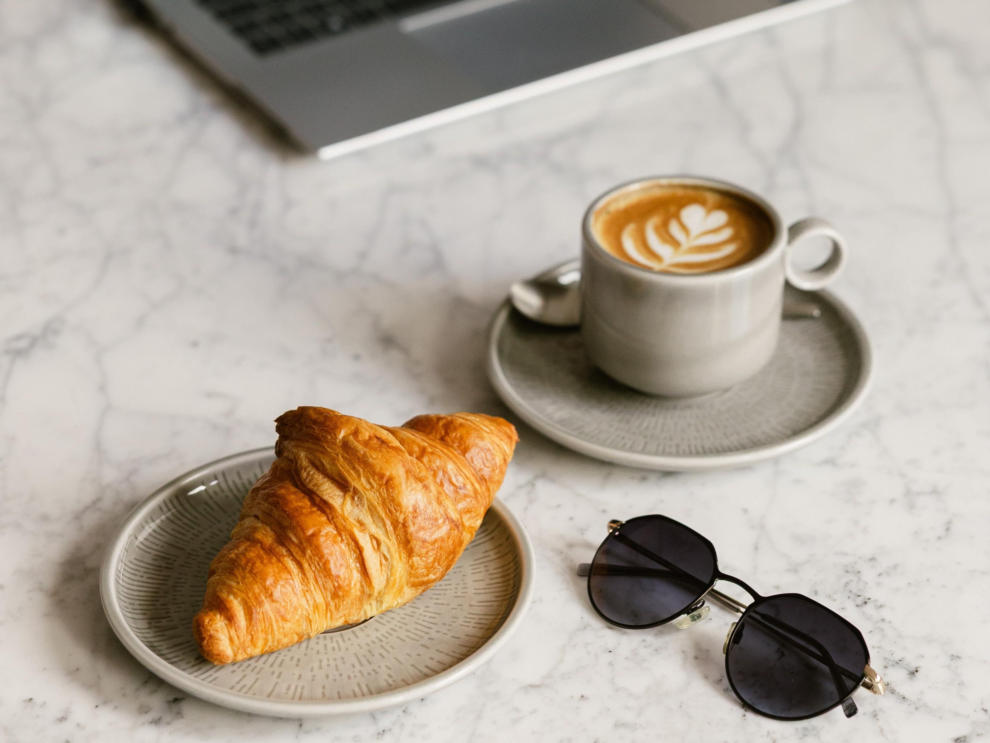 Pastry and coffee and sunglasess