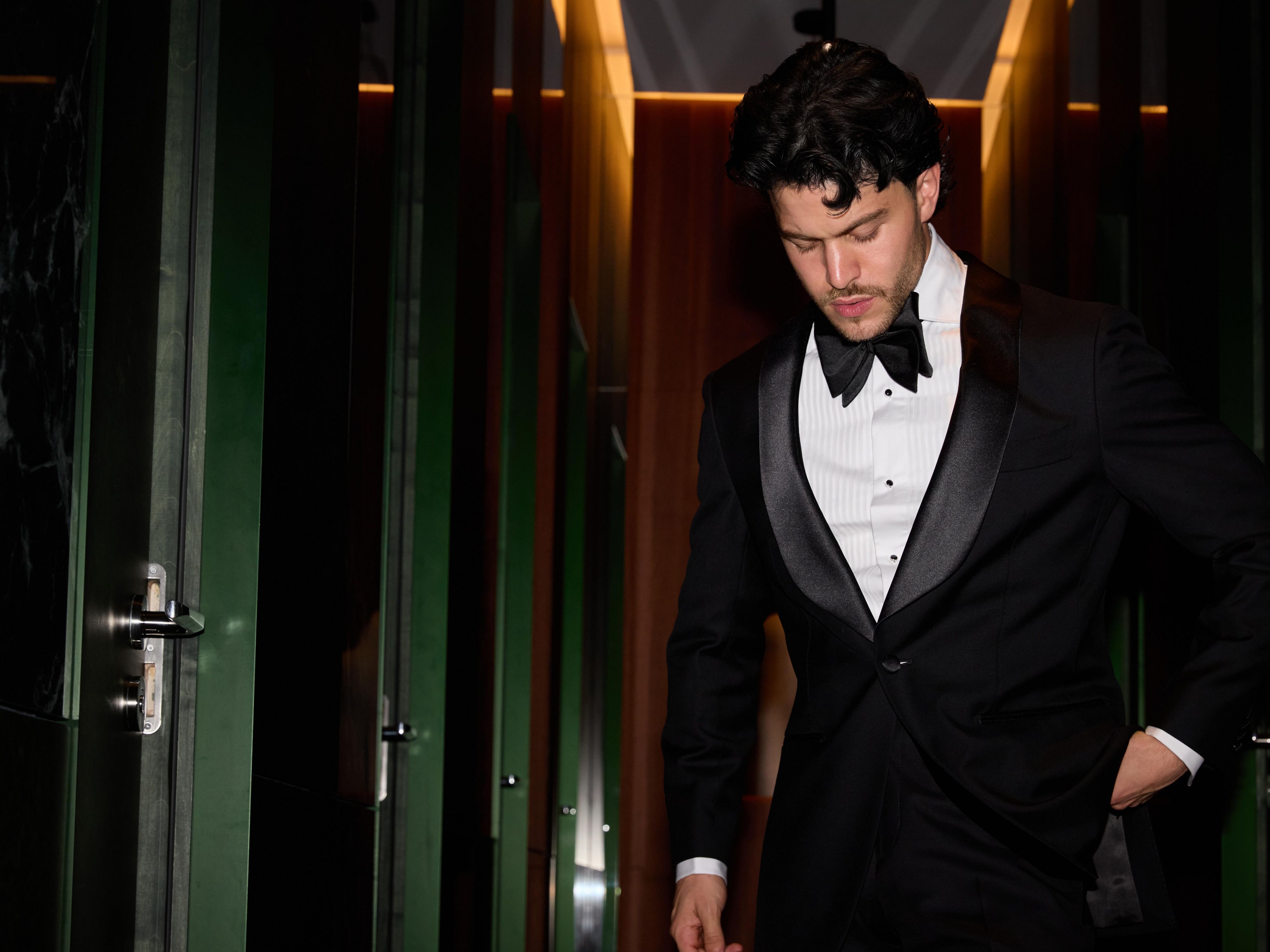 Man in suit walking in hotel