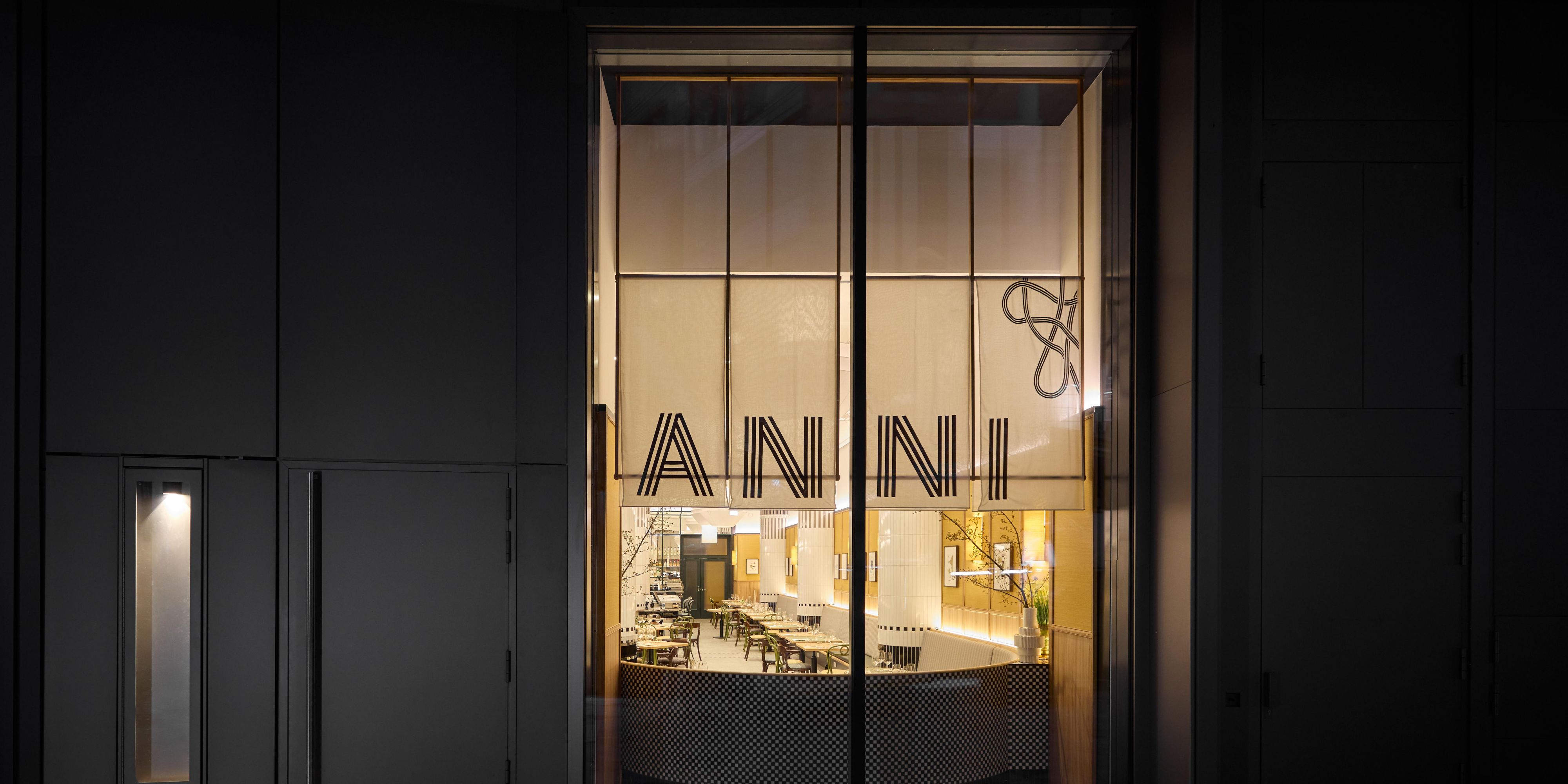 Anni brasserie restaurant from outside perspective with ANNI printed on a large glass window