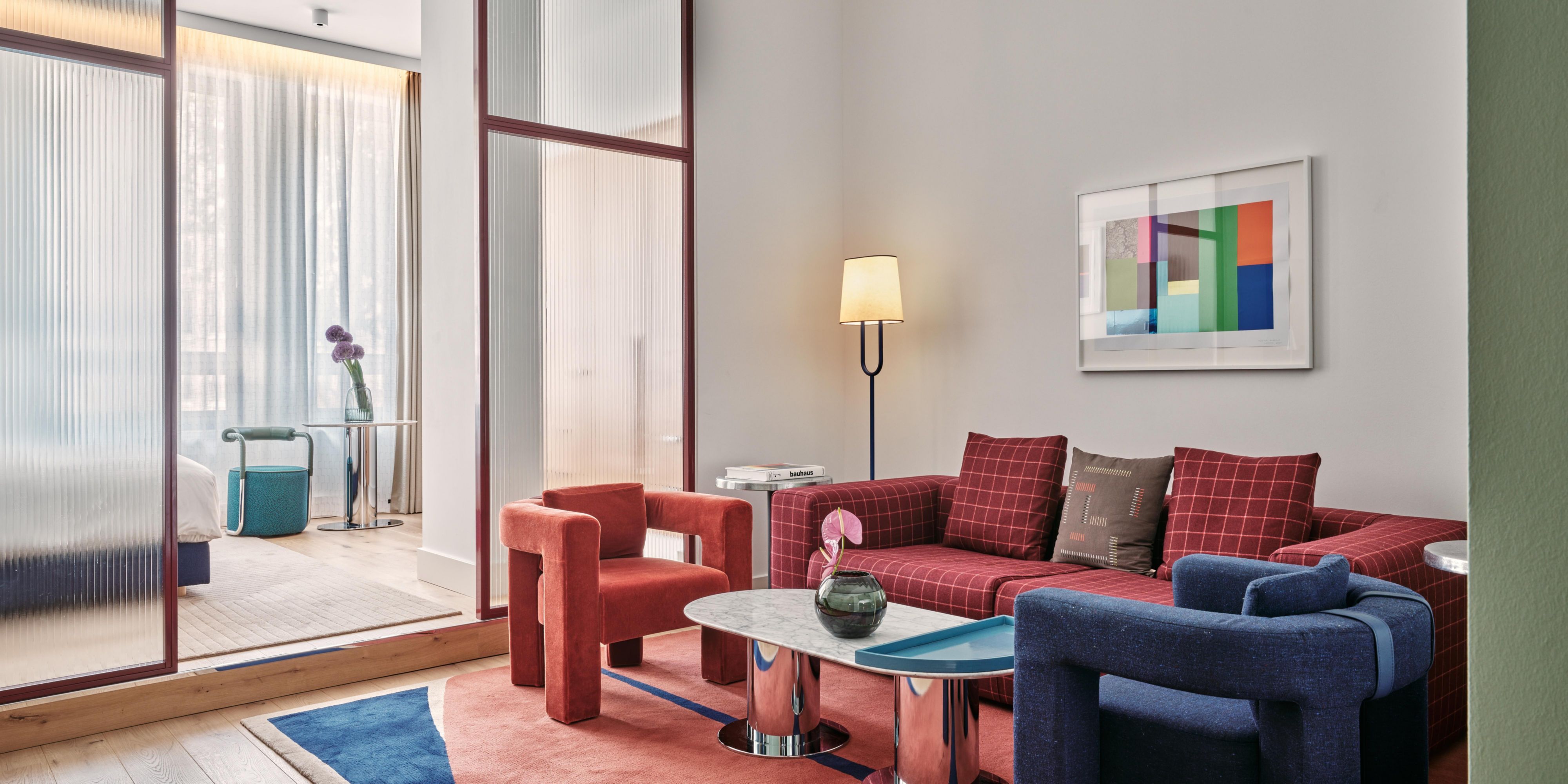One Bedroom Suite featuring bold colours and flashes of chrome.