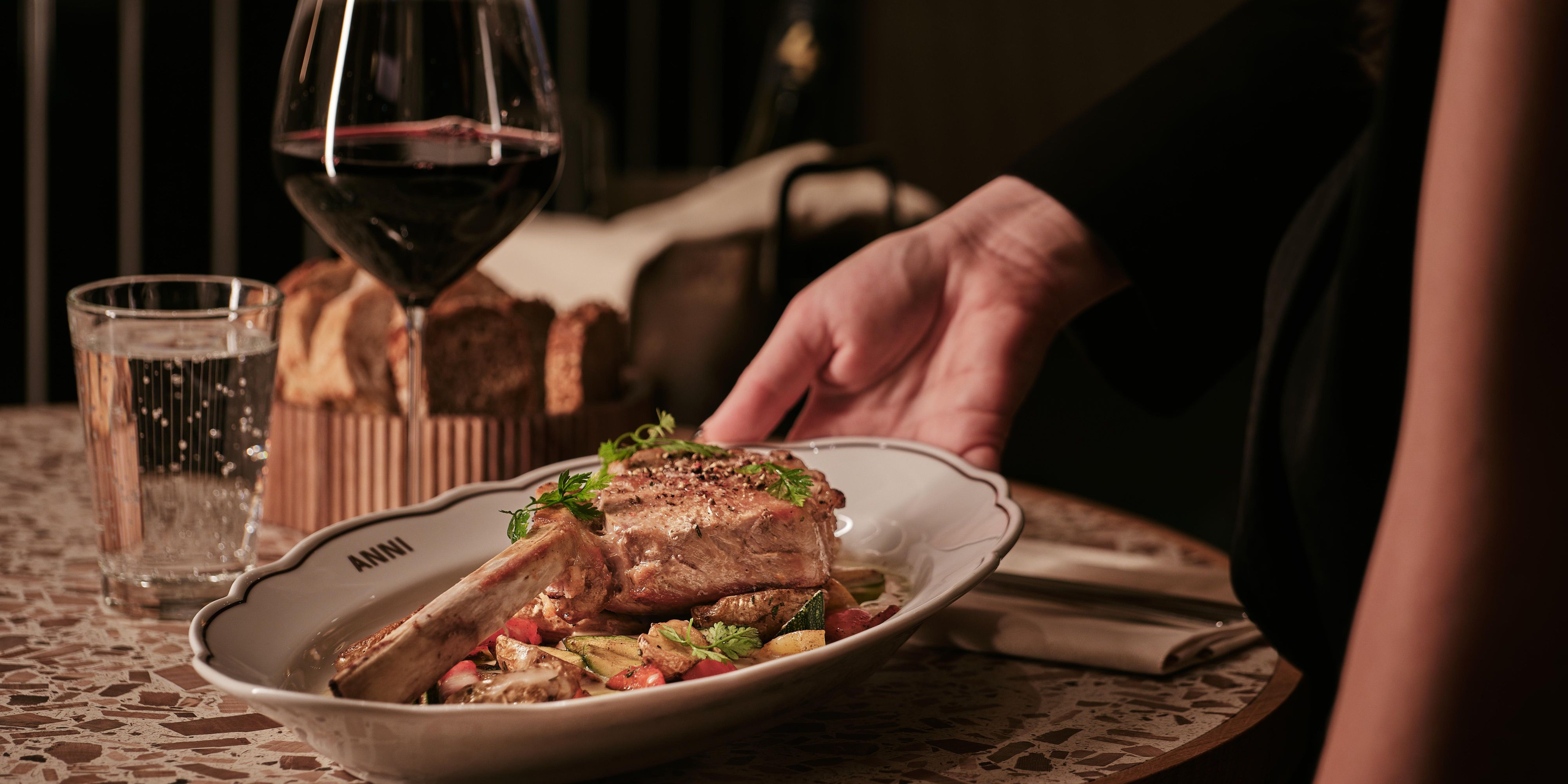 ANNI dish with red wine