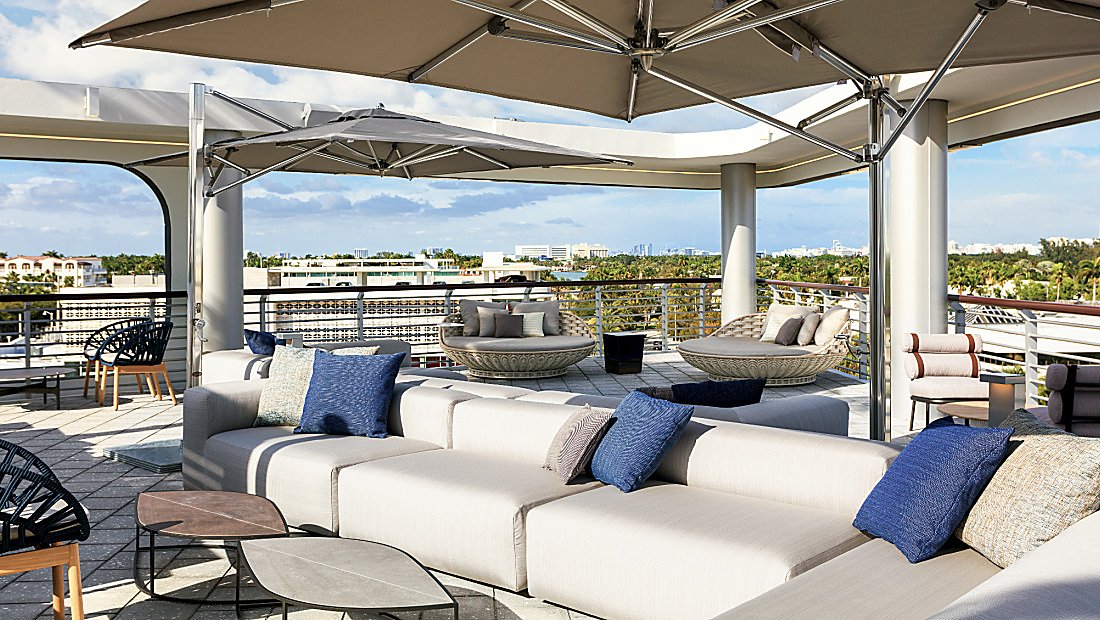 sunny rooftop lounge area with panoramic views