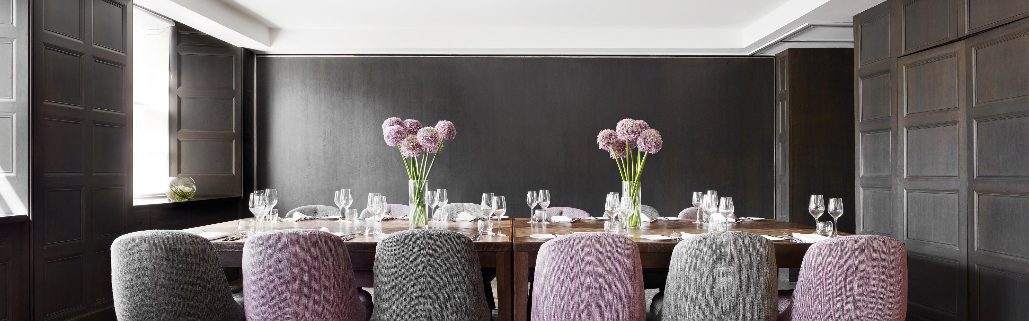 Dining area with purple chairs