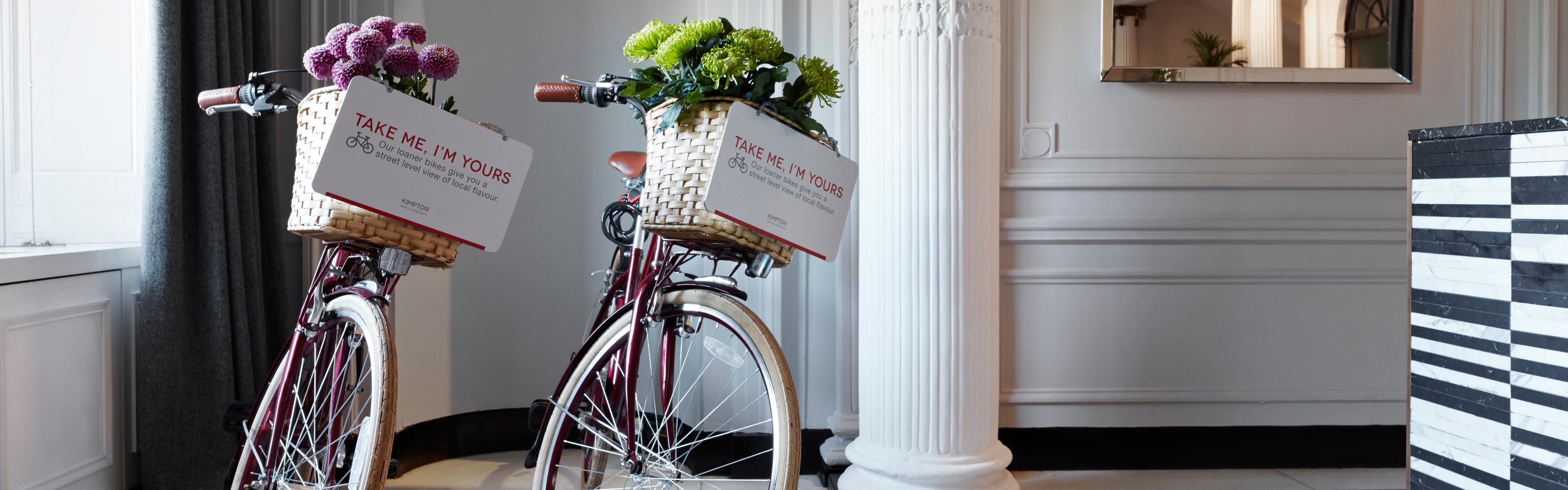 Two bikes sitting in a lobby