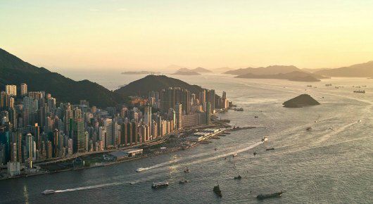 the Hong Kong skyline overlooking the harbor at sunset