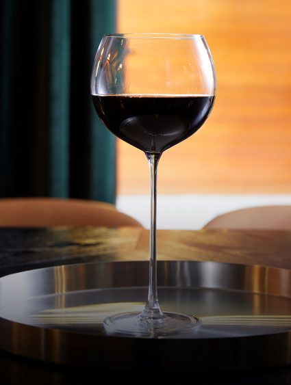 glass of red wine on a cocktail table