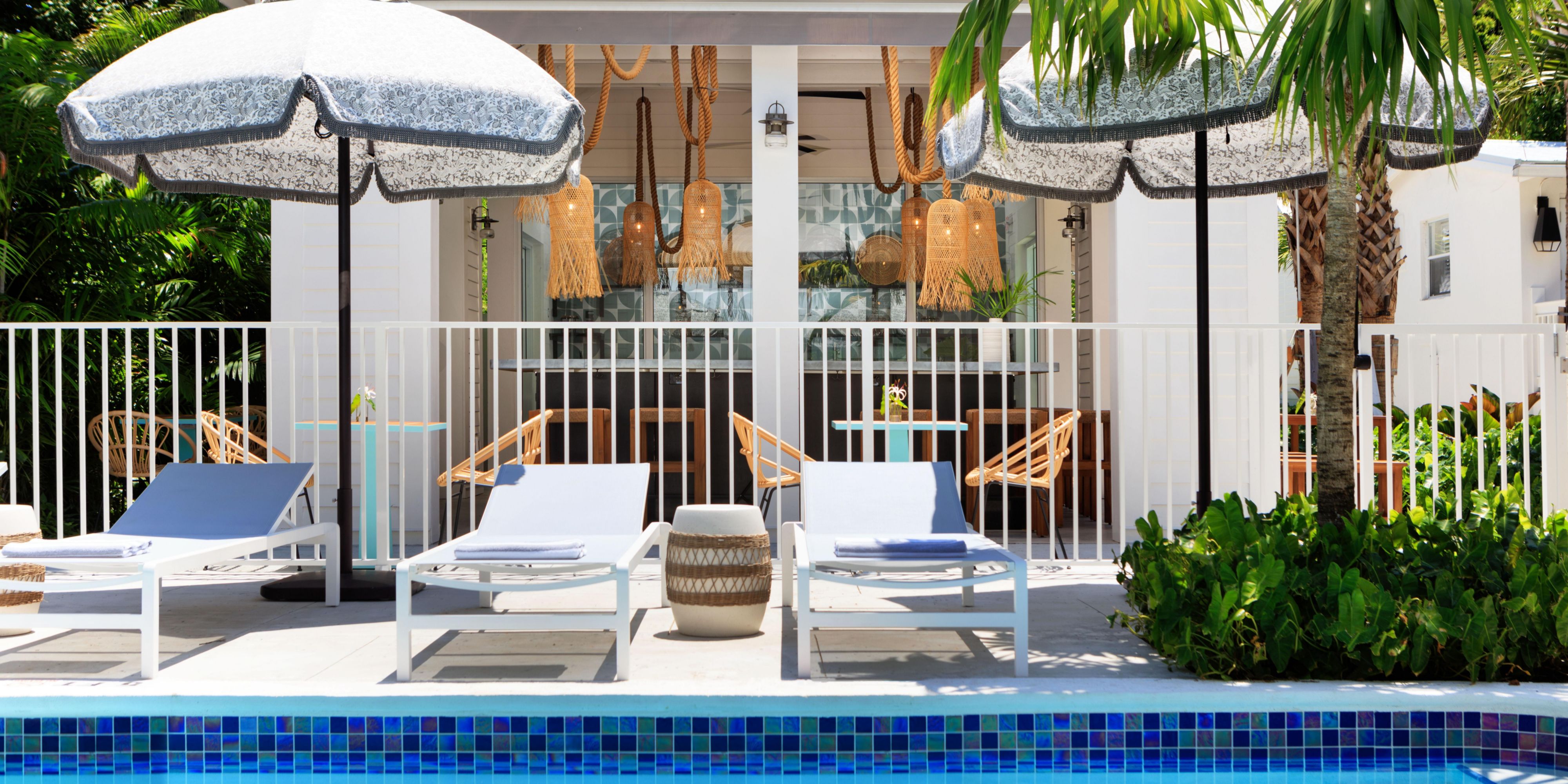 On sunny days and balmy evenings, very little beats lounging by the pool. At Winslow's Bungalows, you have three pools to choose from. One is tricked out with a tropical bar and breakfast pavilion—perfect for bagels and fruit by morning, 'ritas and rum by night. All our pools are surrounded by low-hanging trees and lush grounds for paradise vibes.