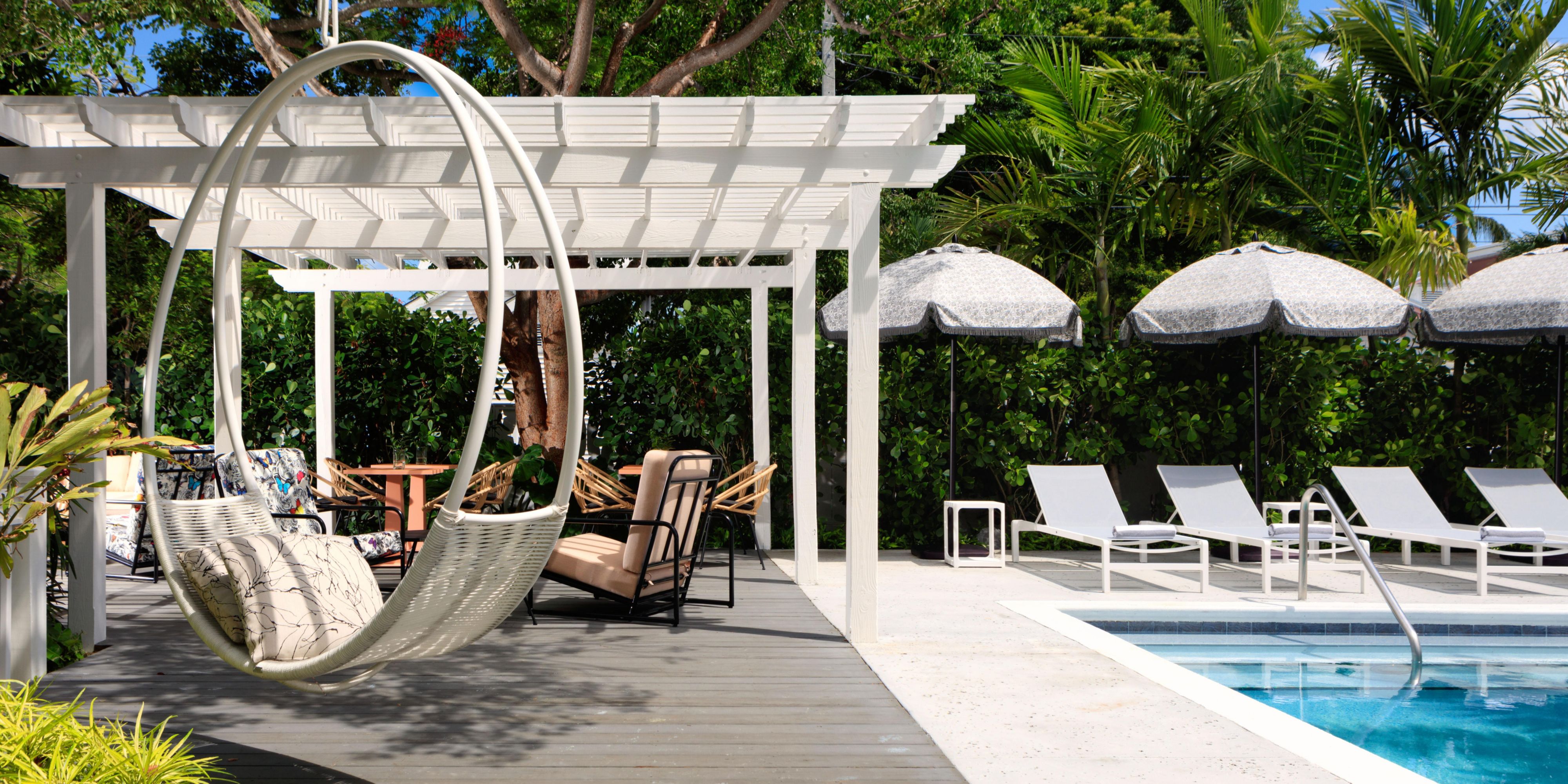 Every night at Mallory Square, sunsets are celebrated with fanfare. Every day at Ella’s Cottages, sunshine is celebrated with quiet glee. Our picturesque pool is a secluded oasis of glimmering waters, shady palm trees and comfortable lounge chairs. You bring the sunscreen, we’ll bring the sun scene.