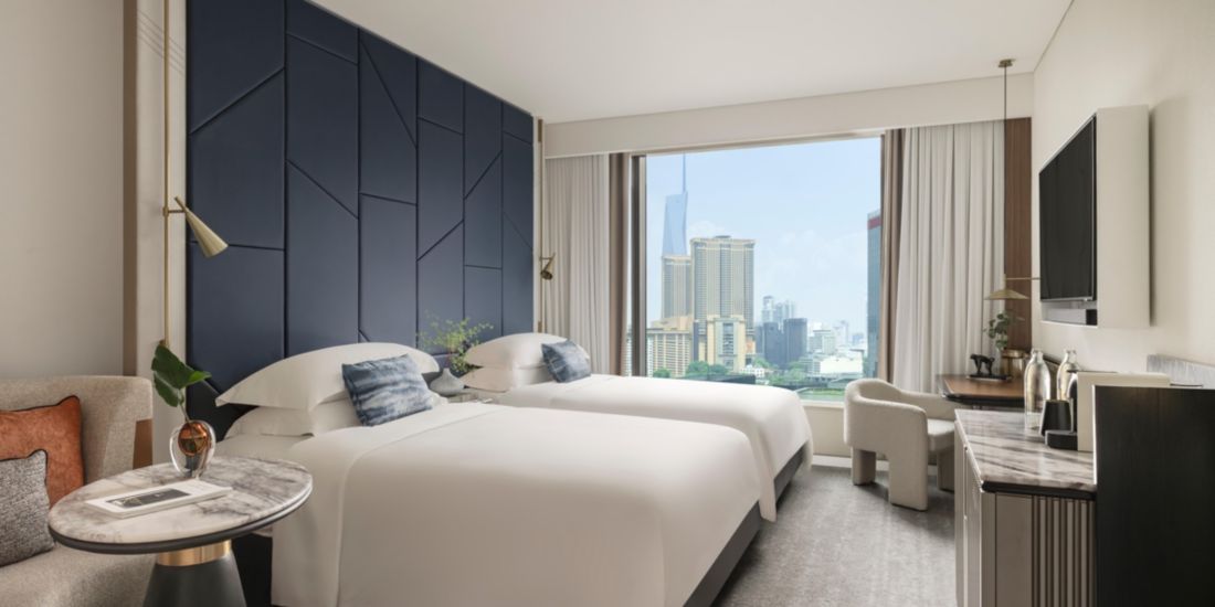 Guestroom decorated in desert colors at Kimpton MIrabel Resort & Villas