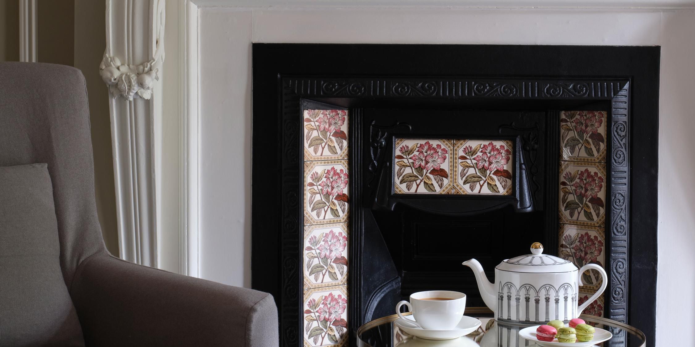 Take a seat by the fireplace and enjoy a moment of relaxation.