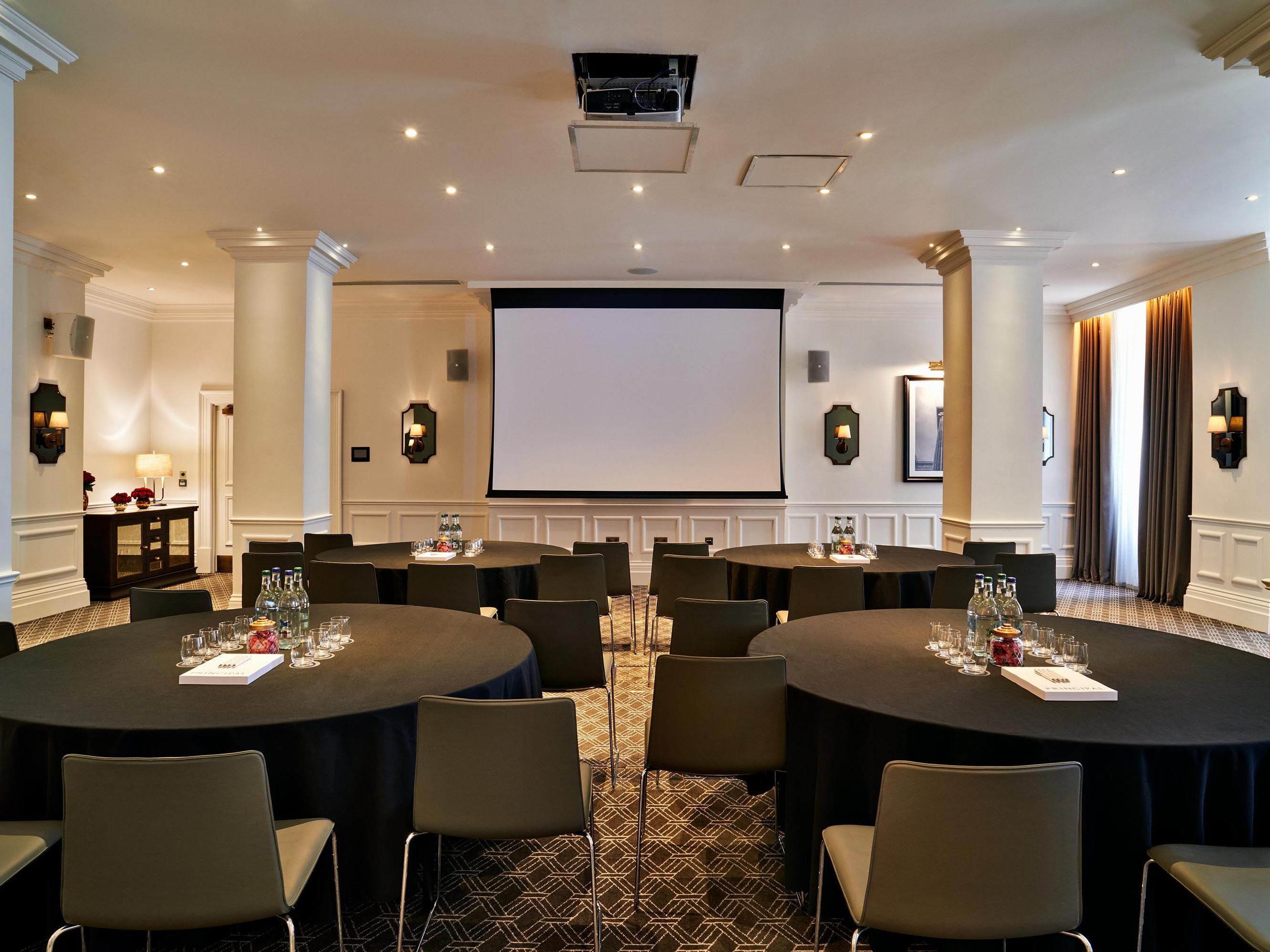 Elevate your presentations in our state-of-the-art meeting rooms