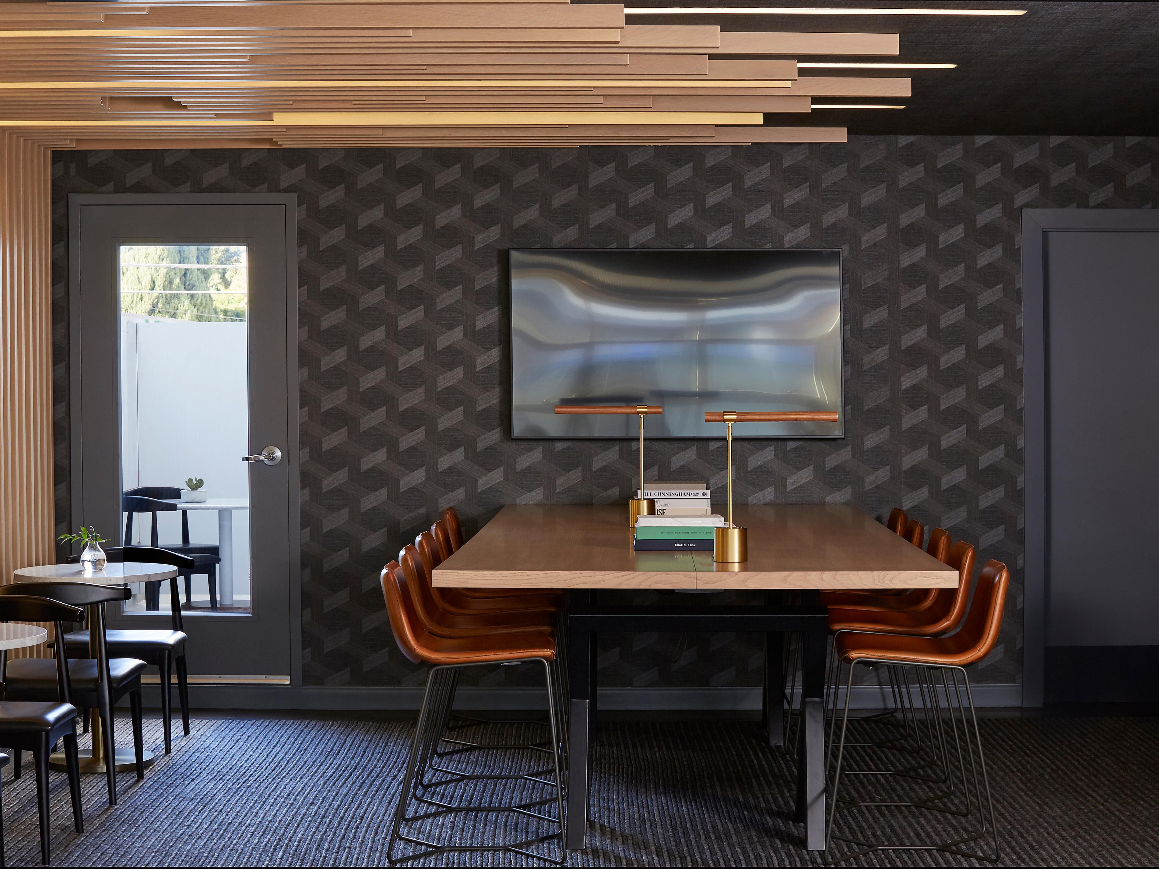 An upscale hotel meeting room with tables around the edges