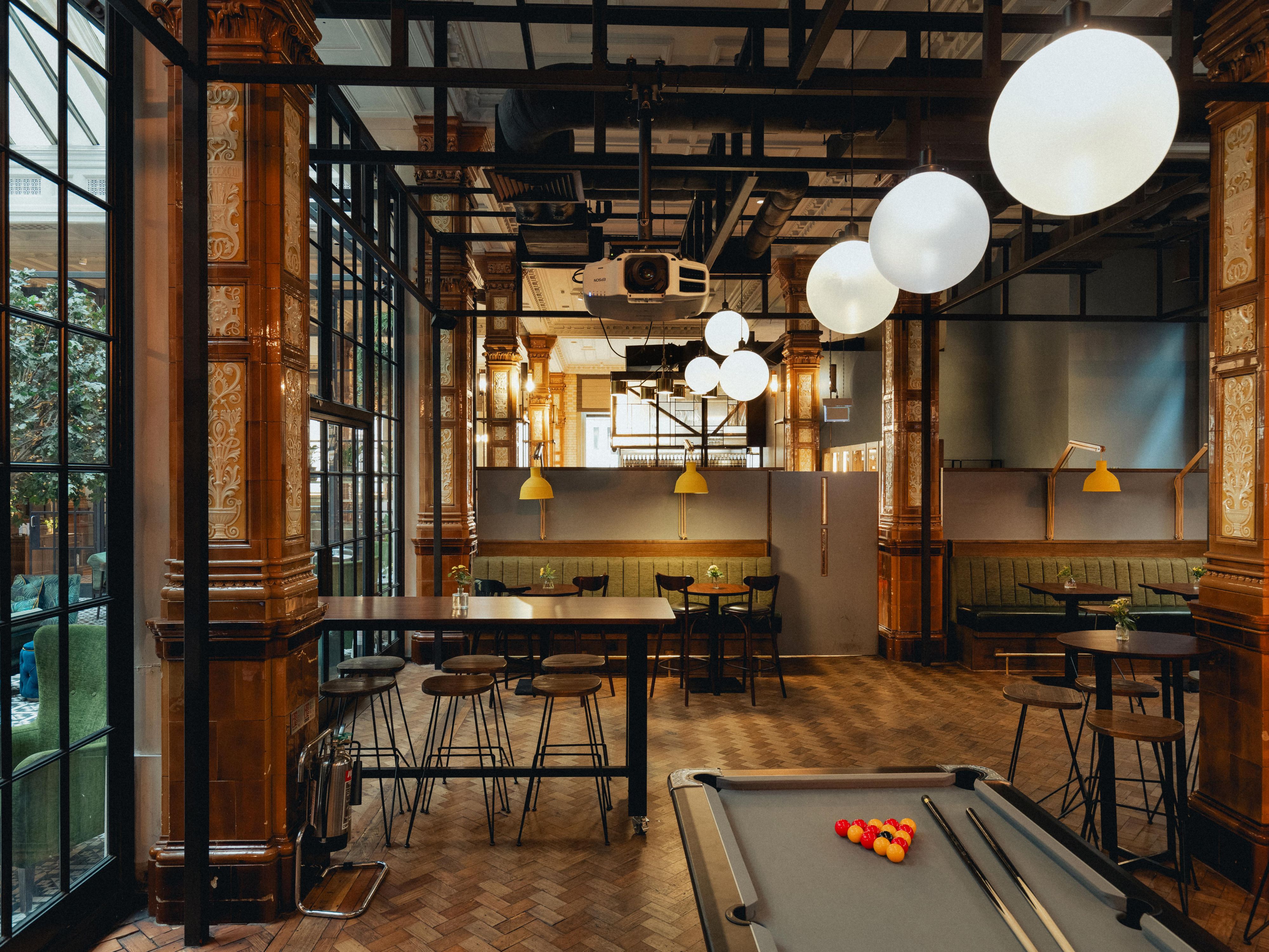 The Den with pool table and seating area