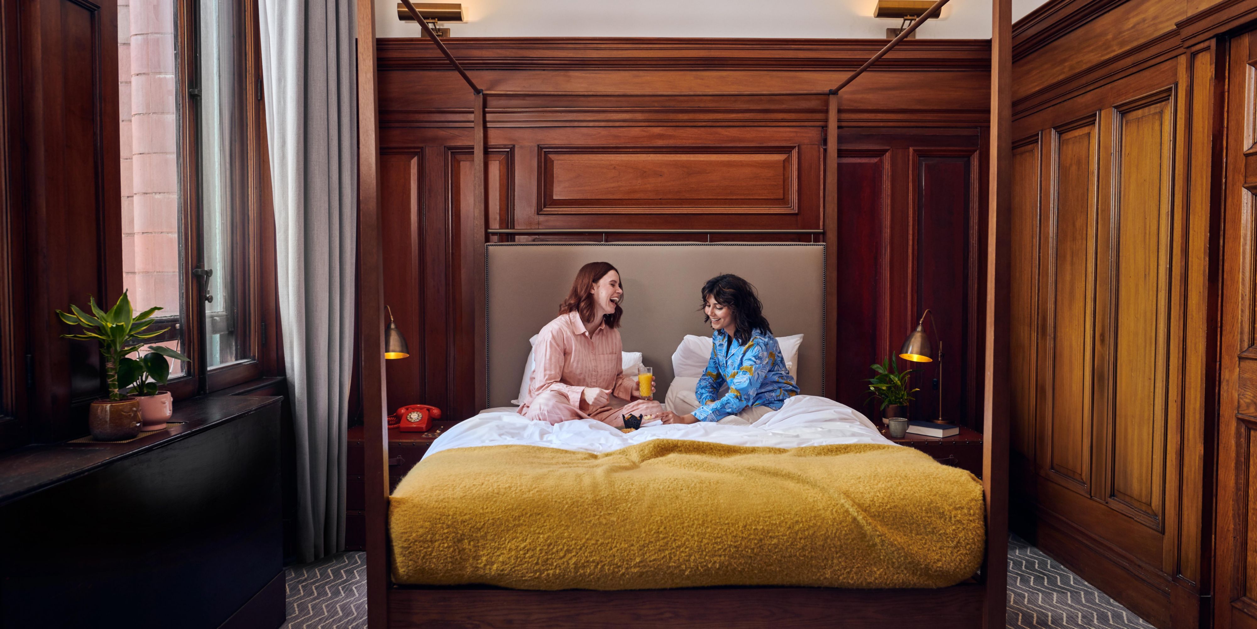 Couple relaxing in hotel guest bed