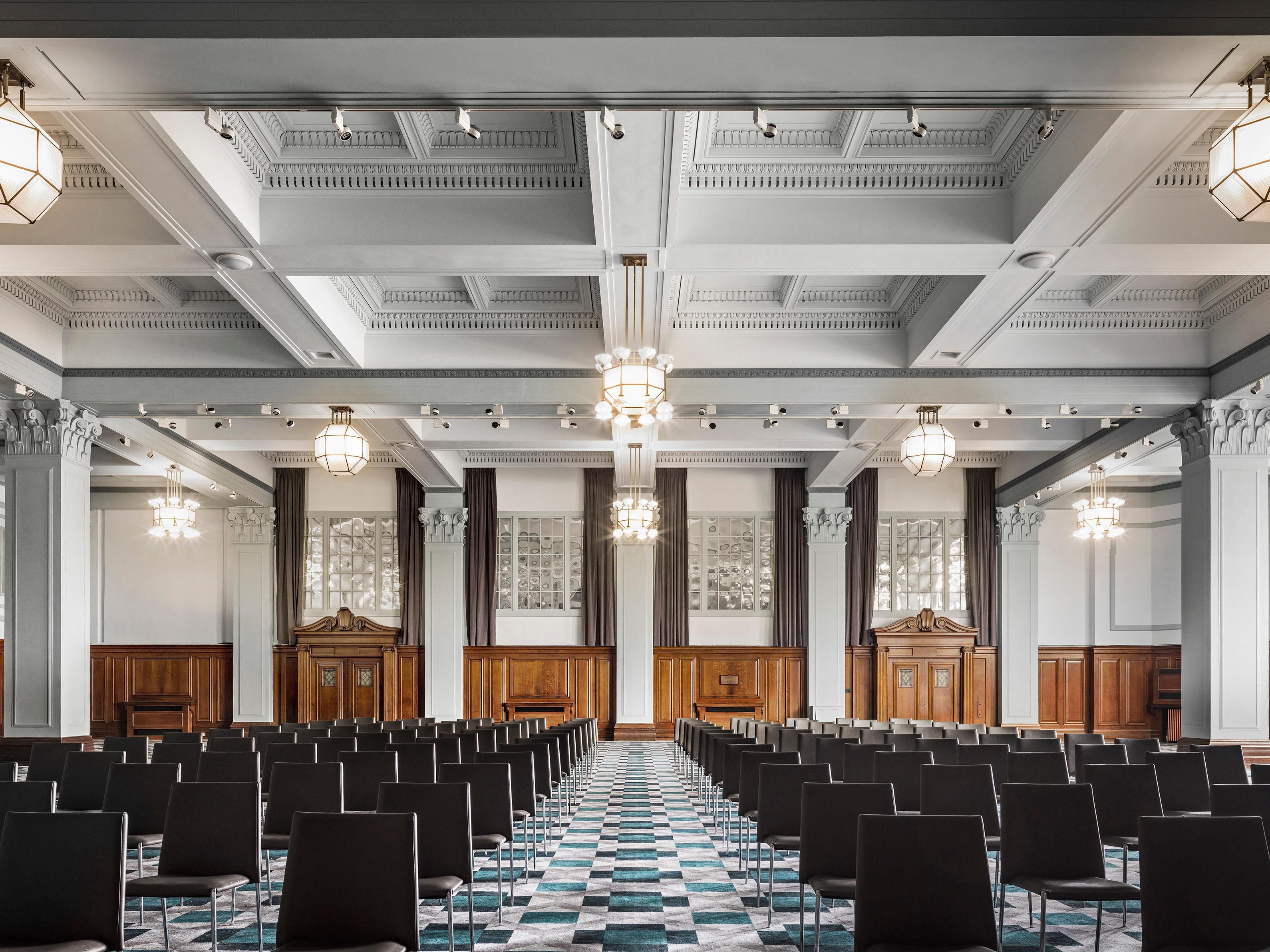 Ballroom set for conference theatre style, stage natural daylight