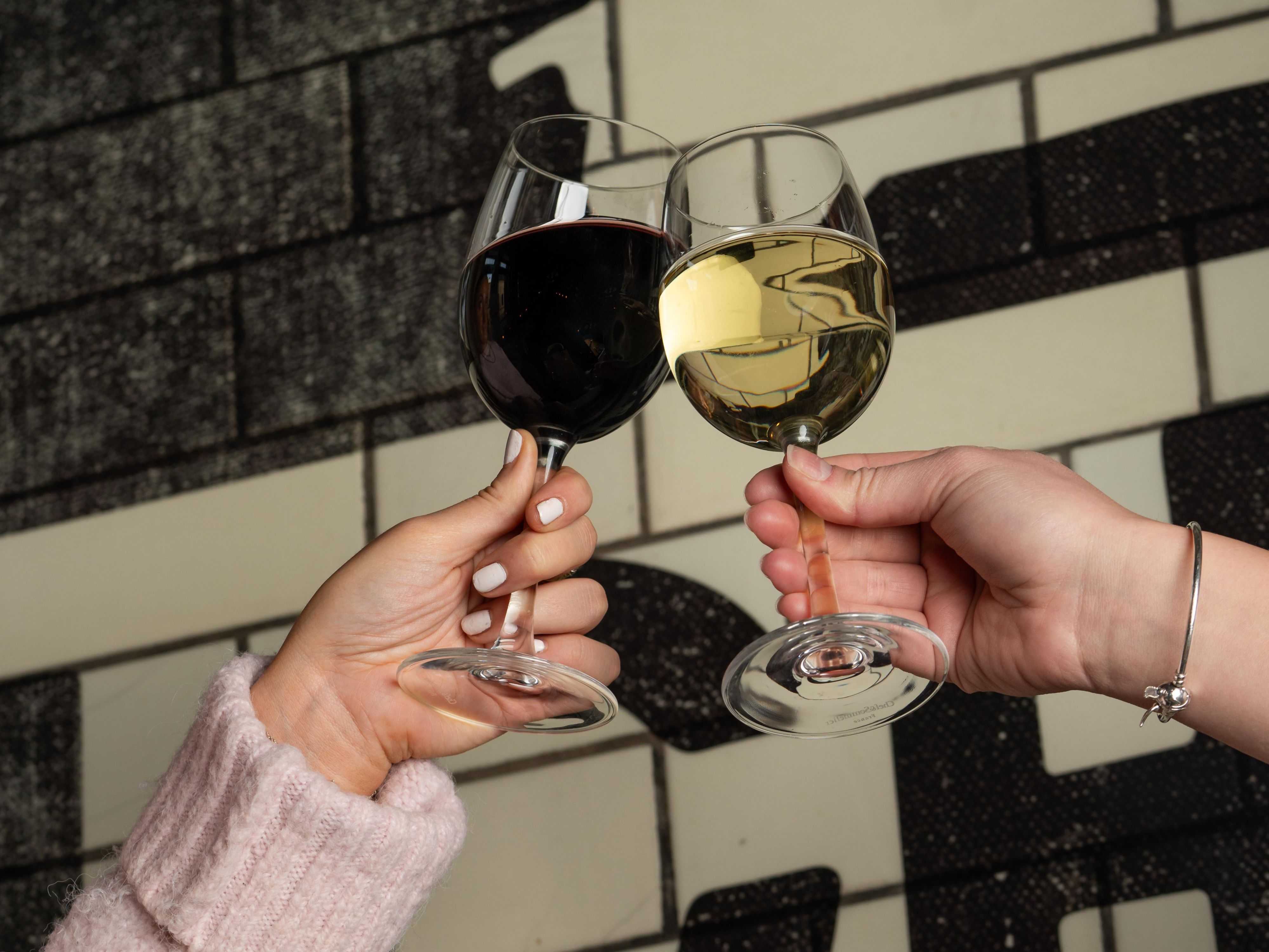 Guests cheering wine glasses