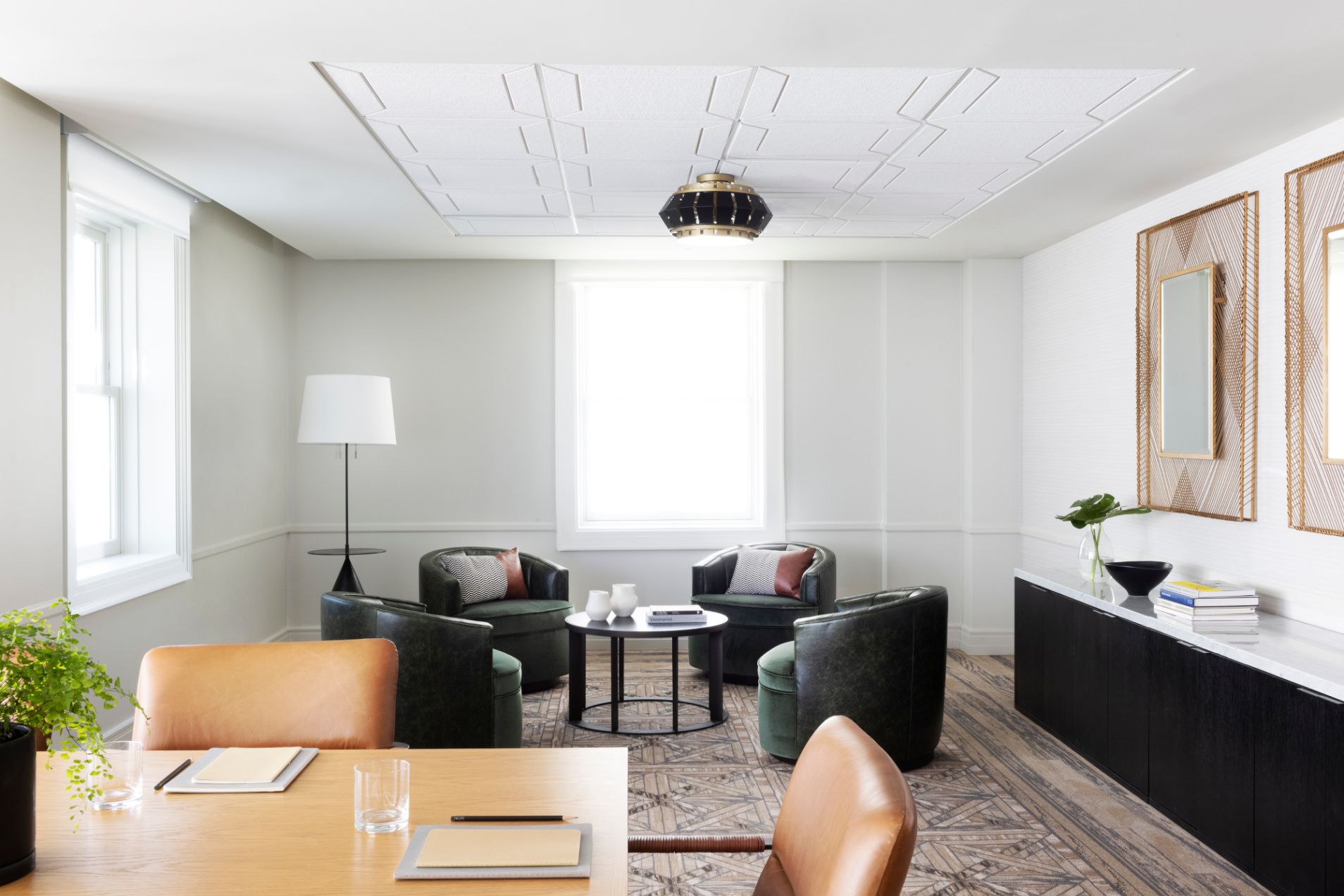 Meeting space with leather stuffed chairs and bright natural ilght