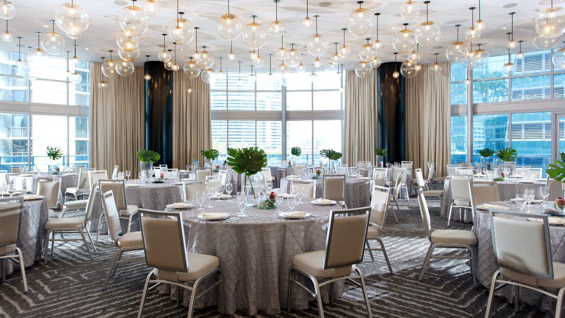 a large, ornate indoor dining room with lots of natural light