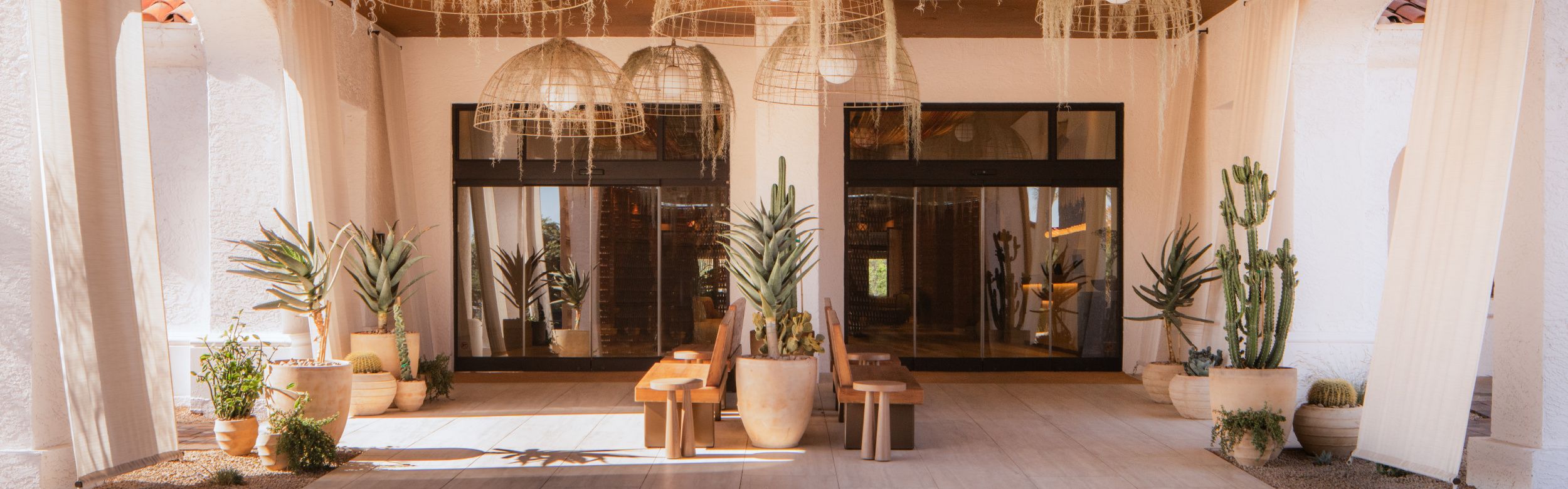 inviting entrance to luxury desert resort at Kimpton Miralina Resort & Villas